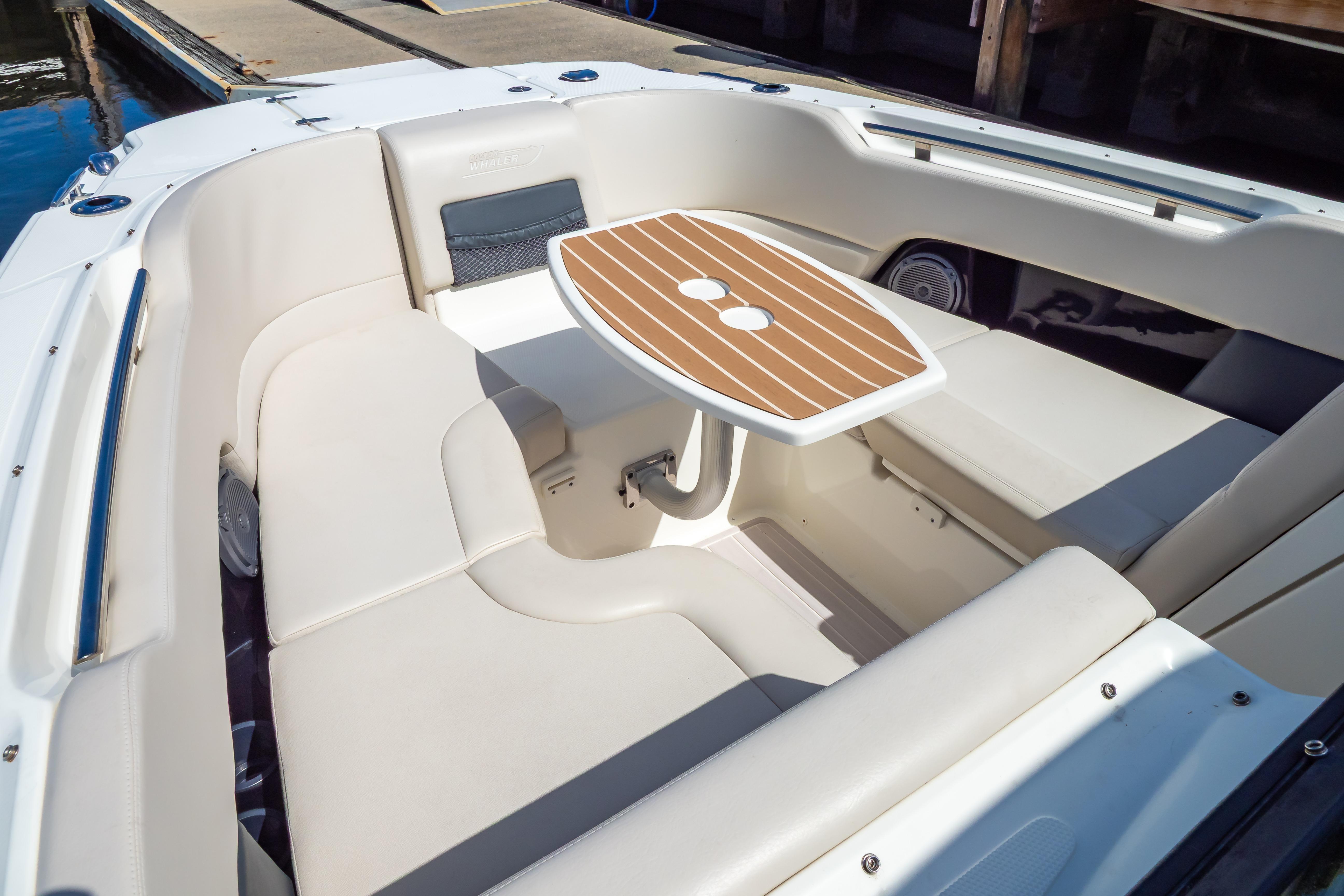 2019 Boston Whaler 270 Vantage boat interior with seating and table.