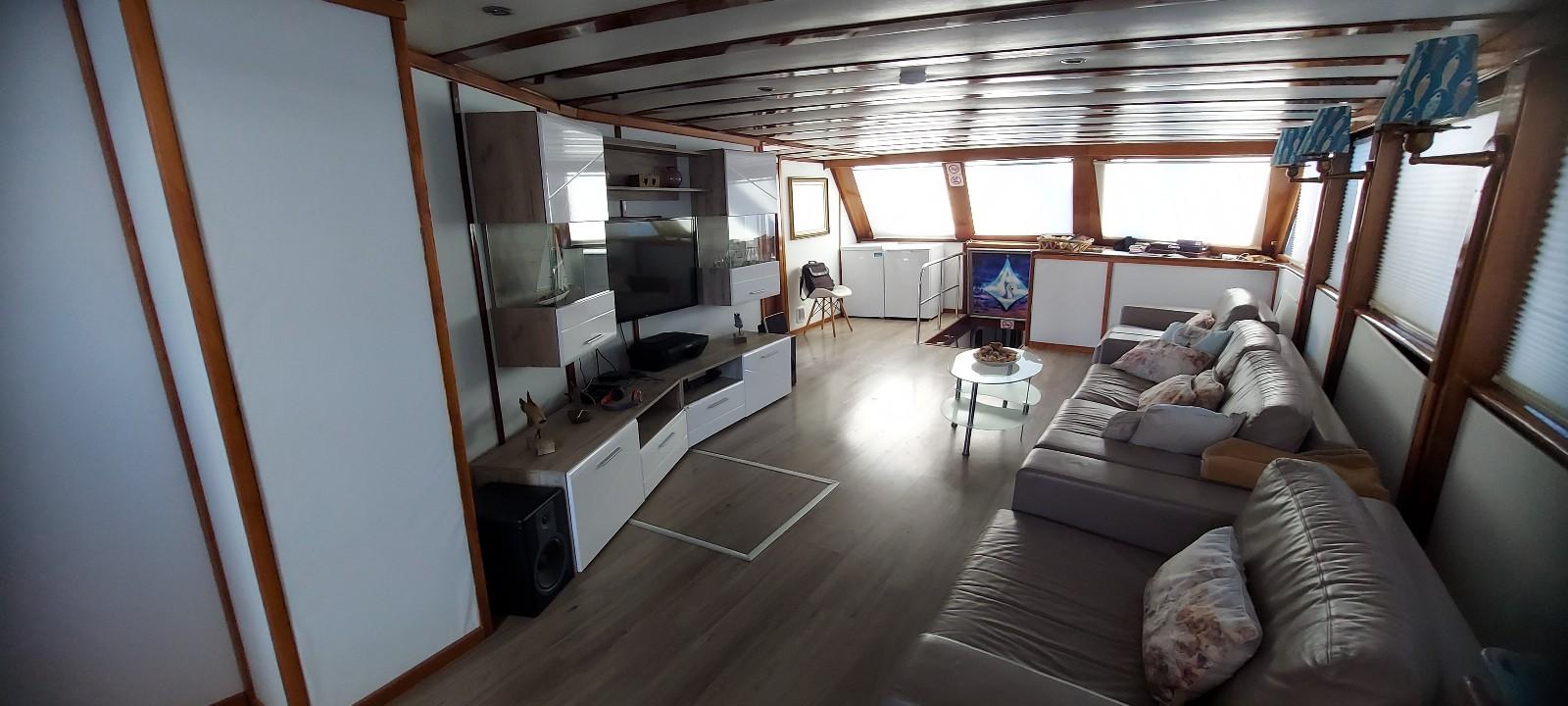 Luxurious interior of 2004 Ketch Laminated Mahogany yacht with spacious seating and modern decor.