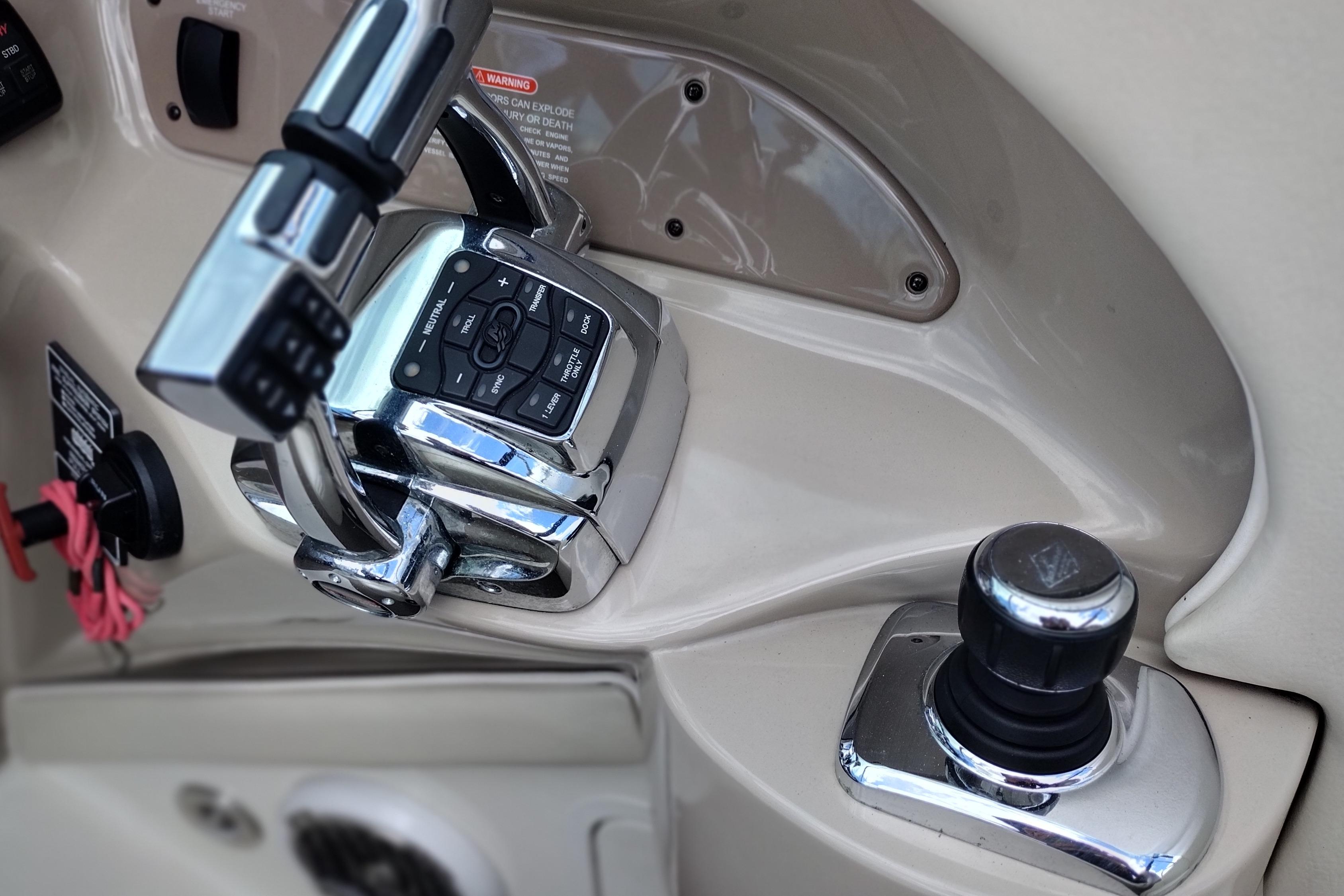 2013 Sea Ray 300 SLX boat controls with chrome throttle and joystick.