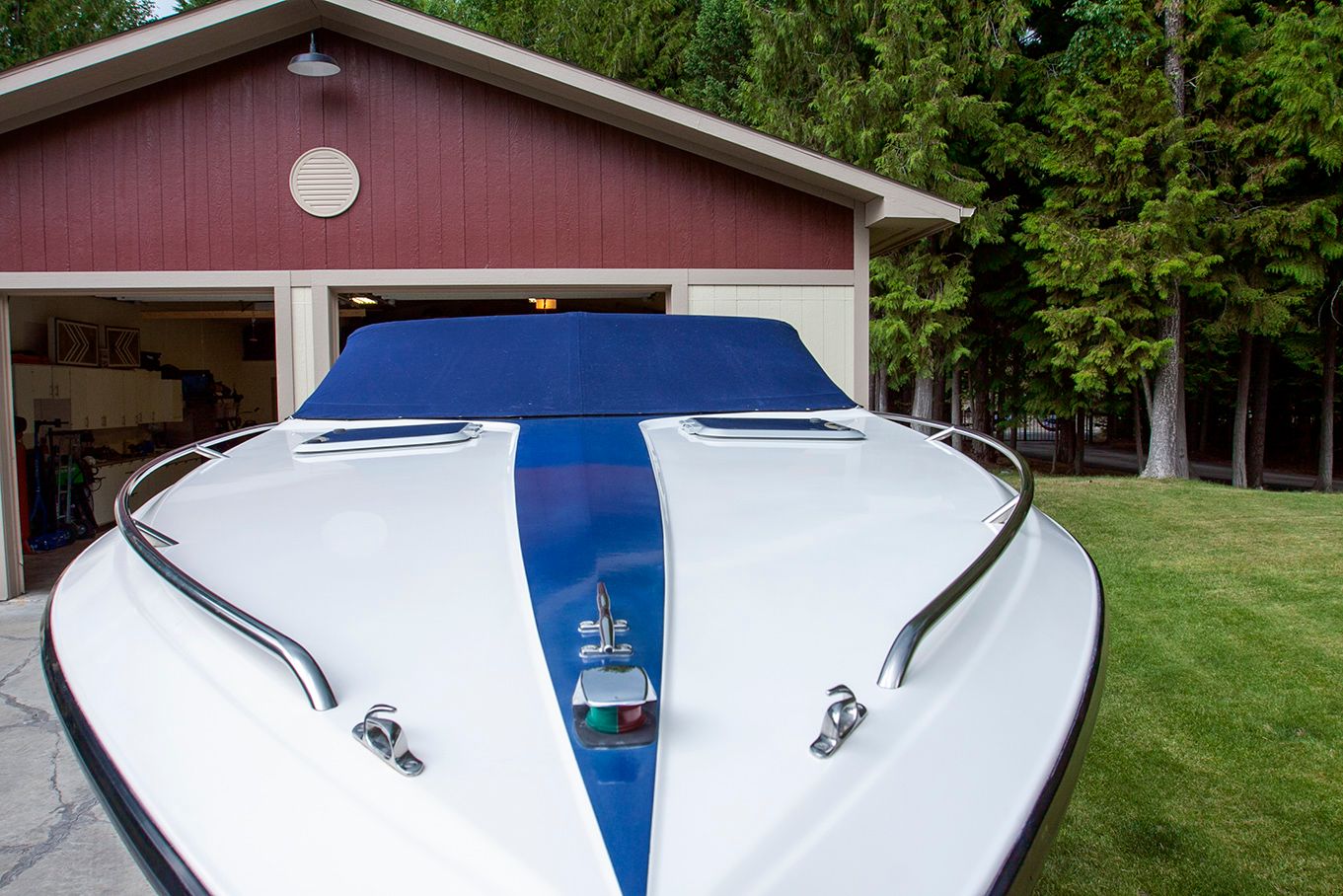 1995 Mirage Trovare 275 boat in front of red garage.