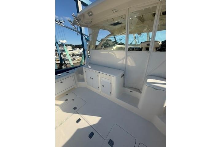 2010 Pursuit OS 375 Offshore boat interior with seating and storage compartments.