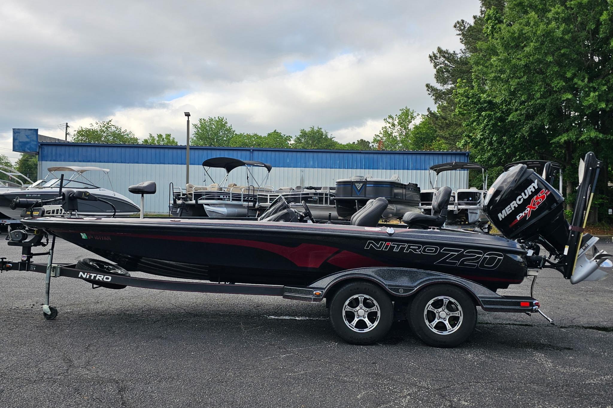 2017 Nitro Z20 Pro bass boat with Mercury engine, parked outdoors.