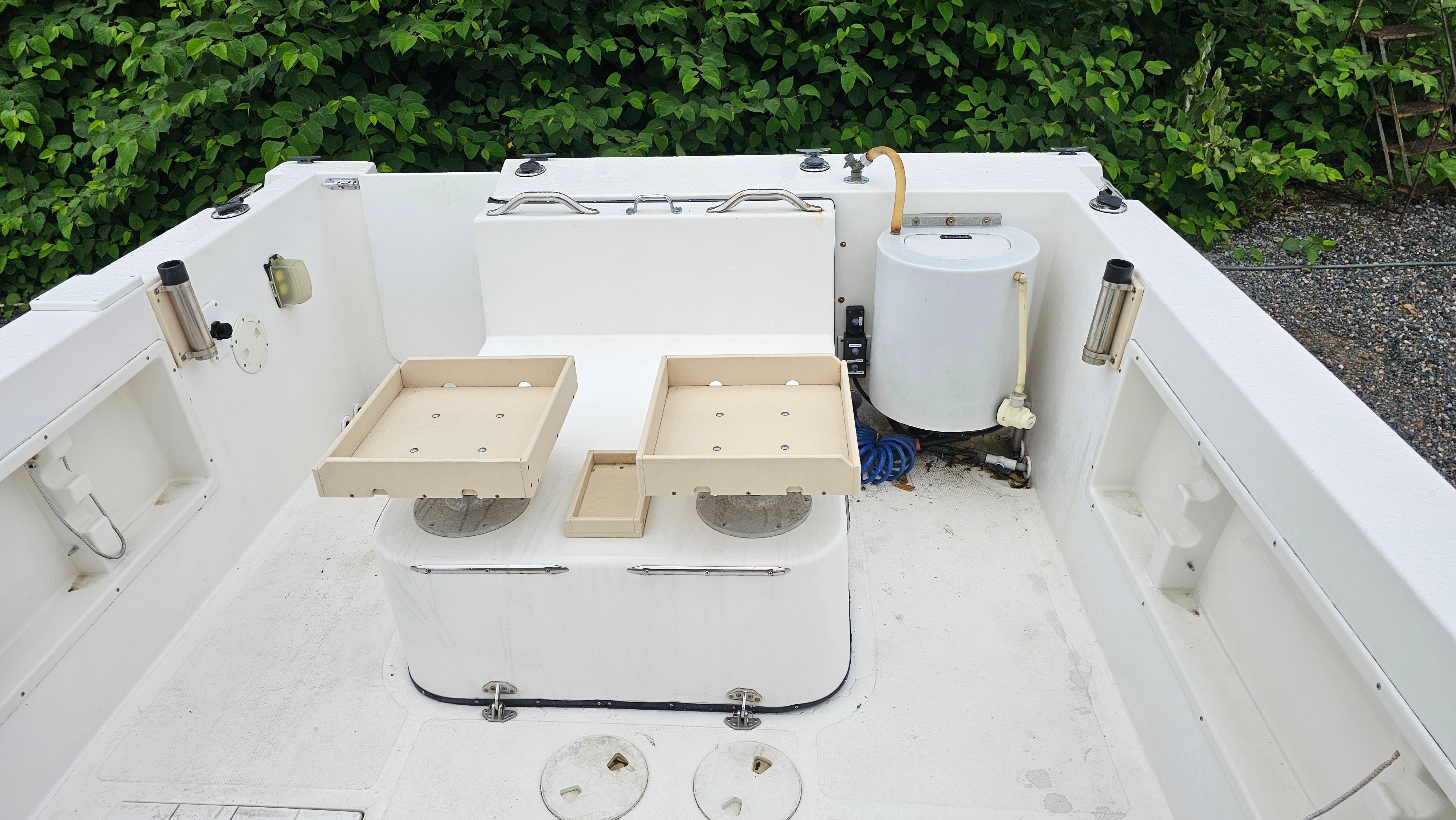 Interior of a 2004 Osprey 26 EXPEDITION boat with storage space.