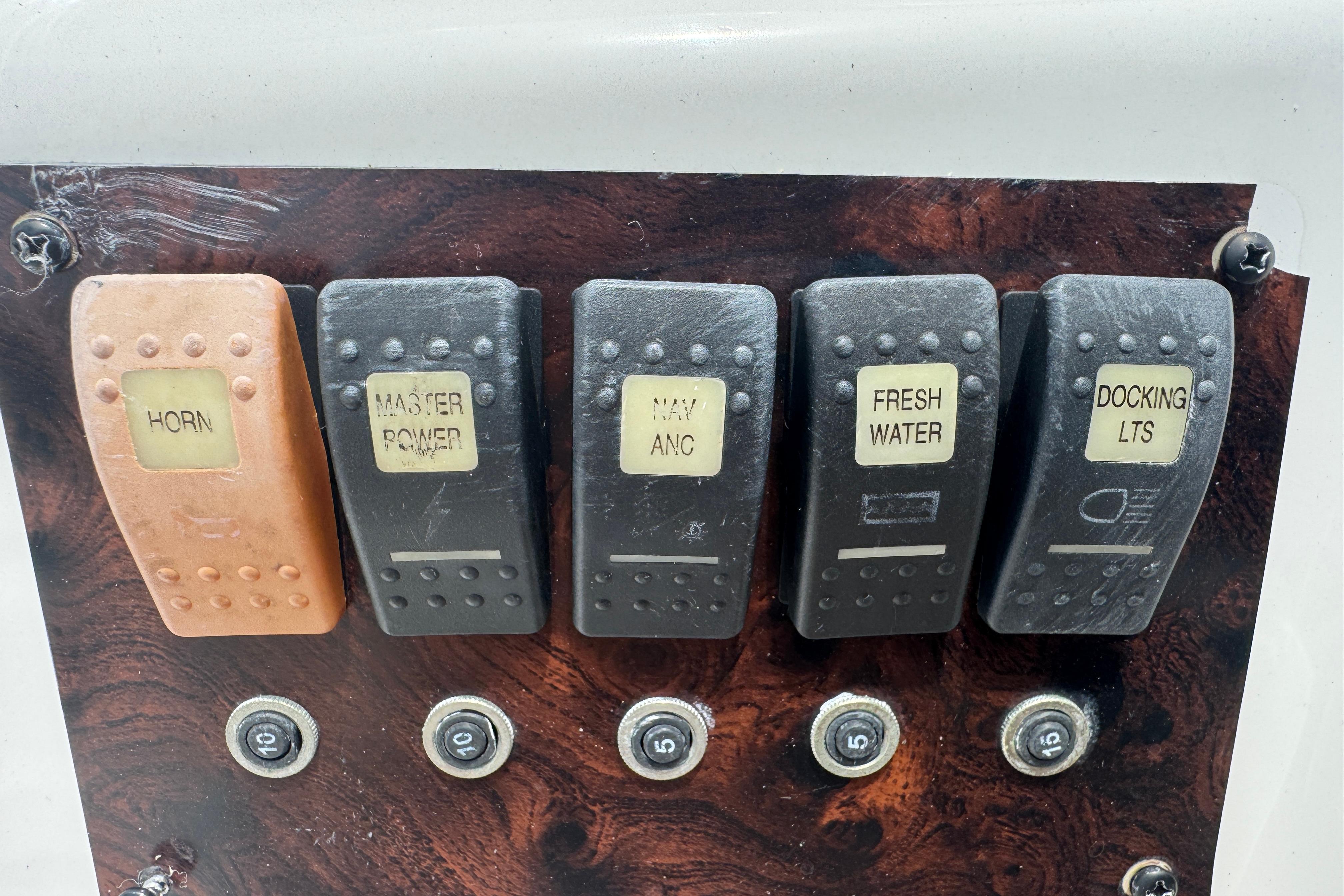 Control panel of a 2013 Hurricane SunDeck Sport 188 OB boat with labeled switches.