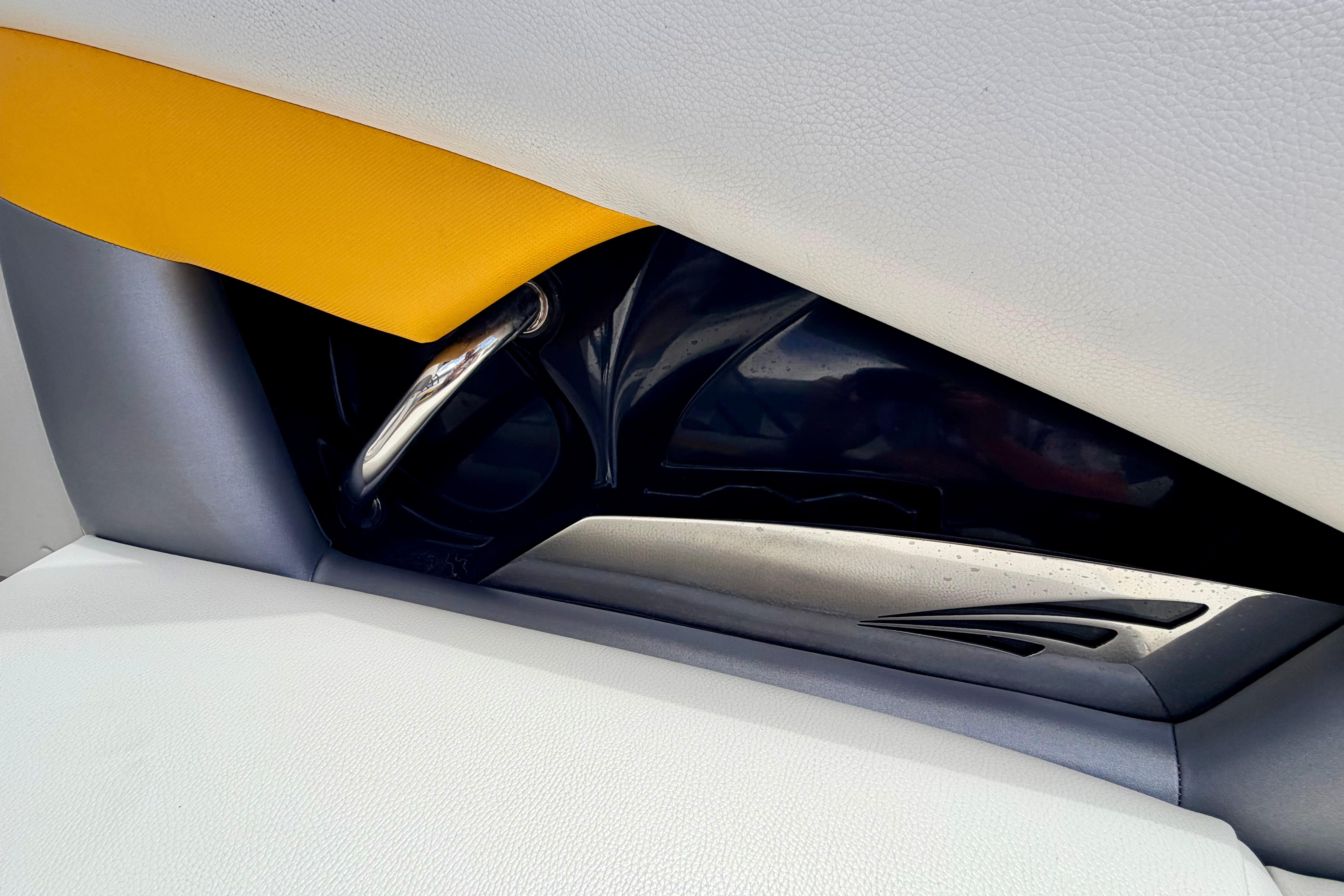 Interior detail of 2014 Tigé R20 boat, featuring sleek design and vibrant upholstery.