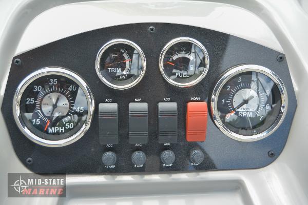 Dashboard of 2024 Lowe Ultra 200 Cruise boat with gauges and controls.