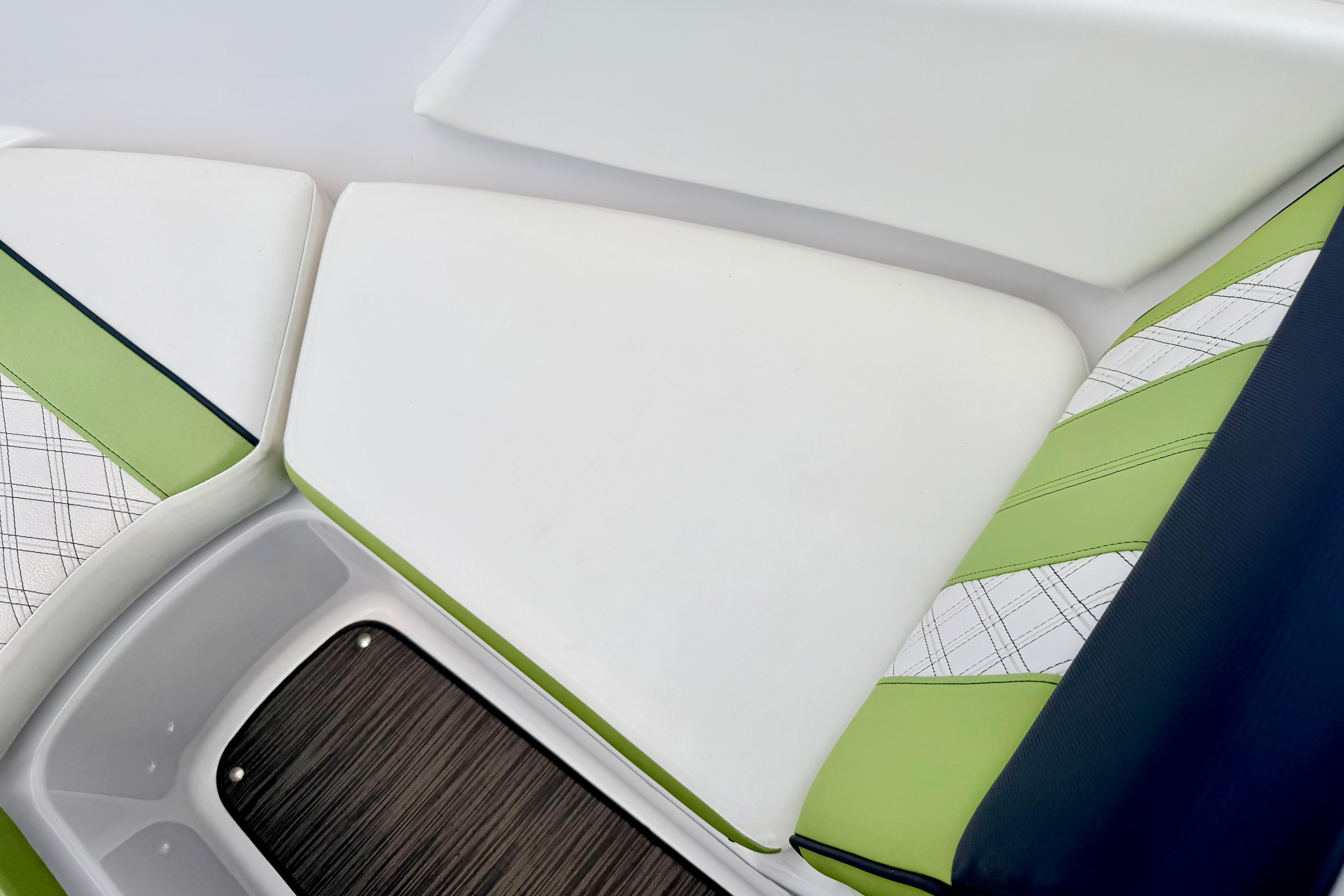 2018 Glastron GT 185 boat interior with green and white seating design.
