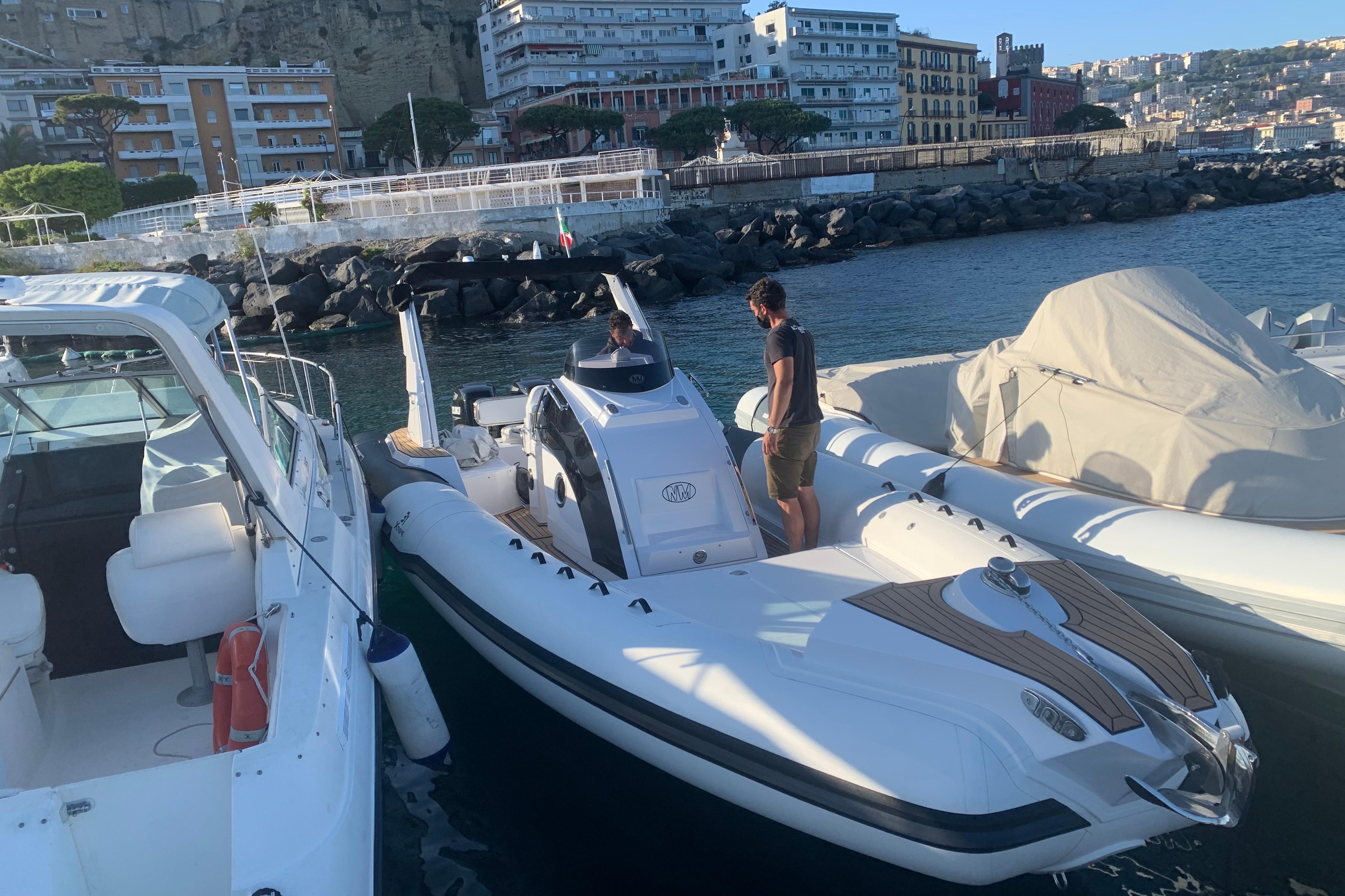 Novamares 31 Extreme 2021 boat docked in a scenic marina setting.