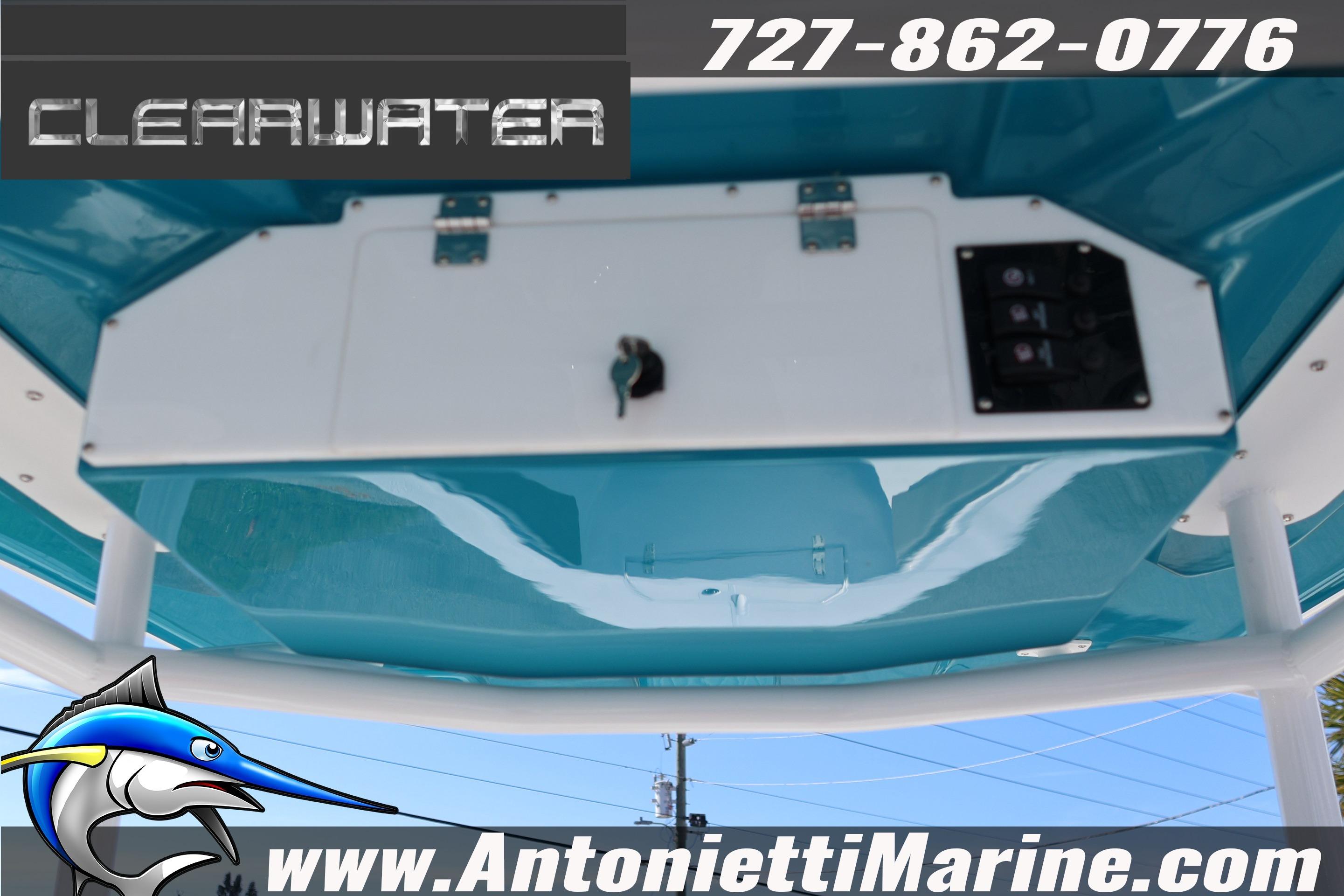 2026 Clearwater 2300 boat console with blue finish, featuring contact details and logo.