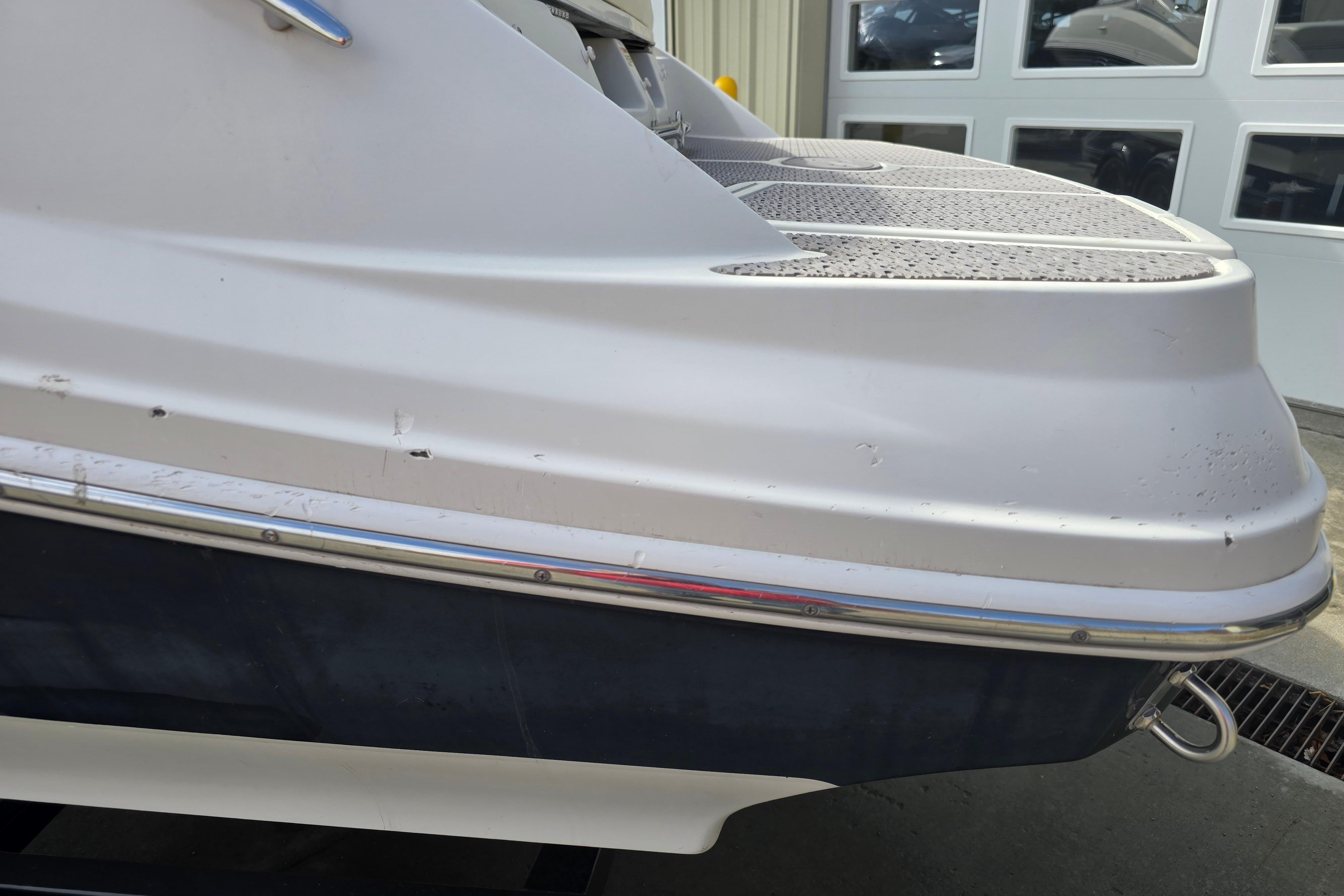 2007 Sea Ray 210 Select boat stern with visible wear and scratches.