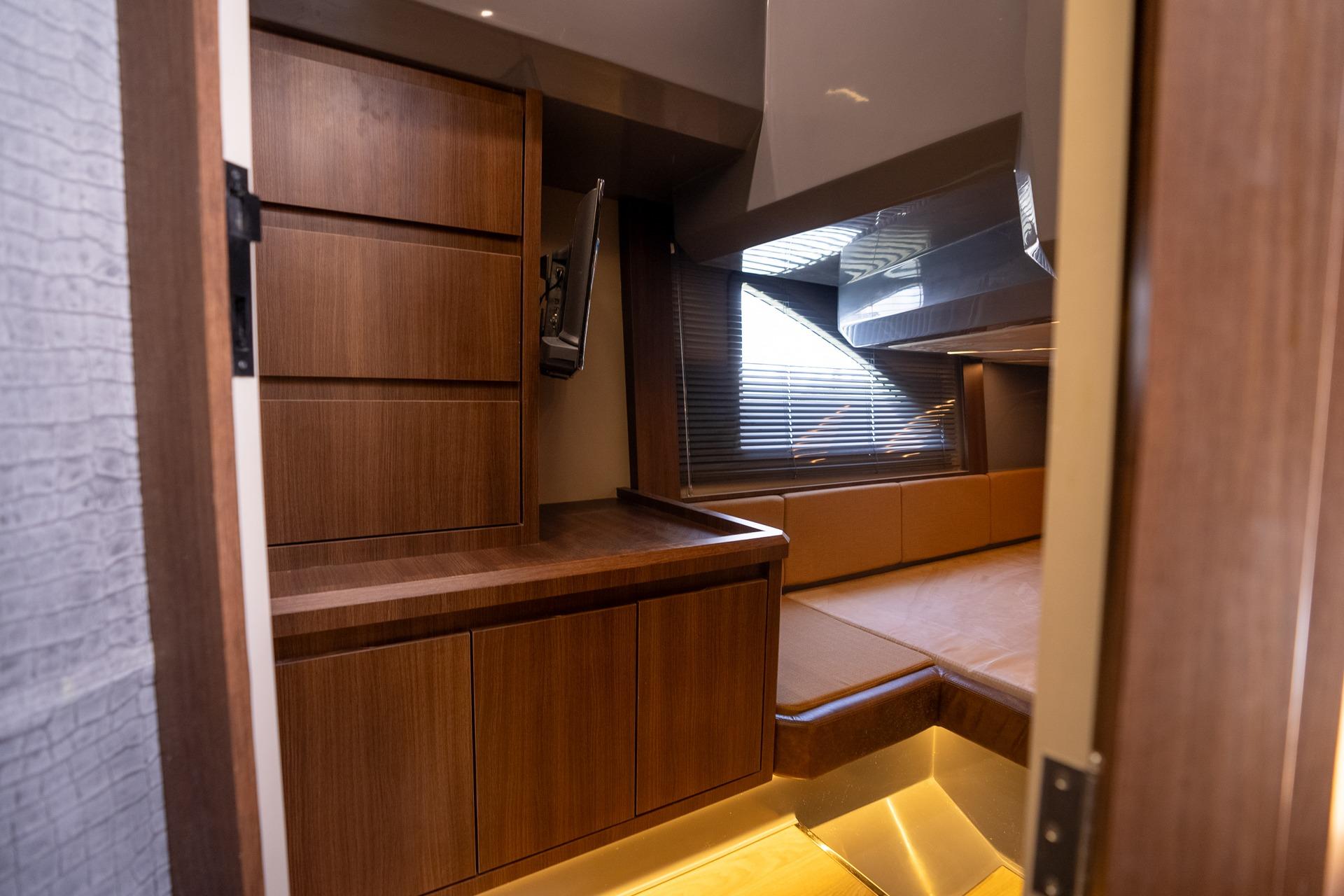 Luxurious interior of 2026 Hanover 447 yacht with sleek wooden cabinetry and modern design.