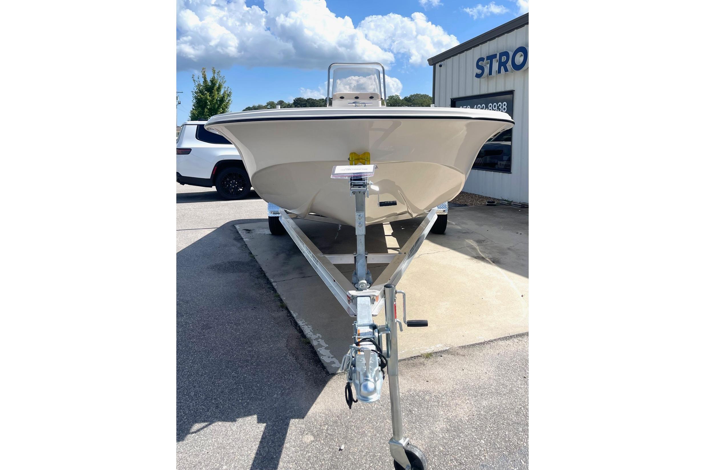 2026 Carolina Skiff 19 LS boat on trailer, parked outdoors under blue sky.