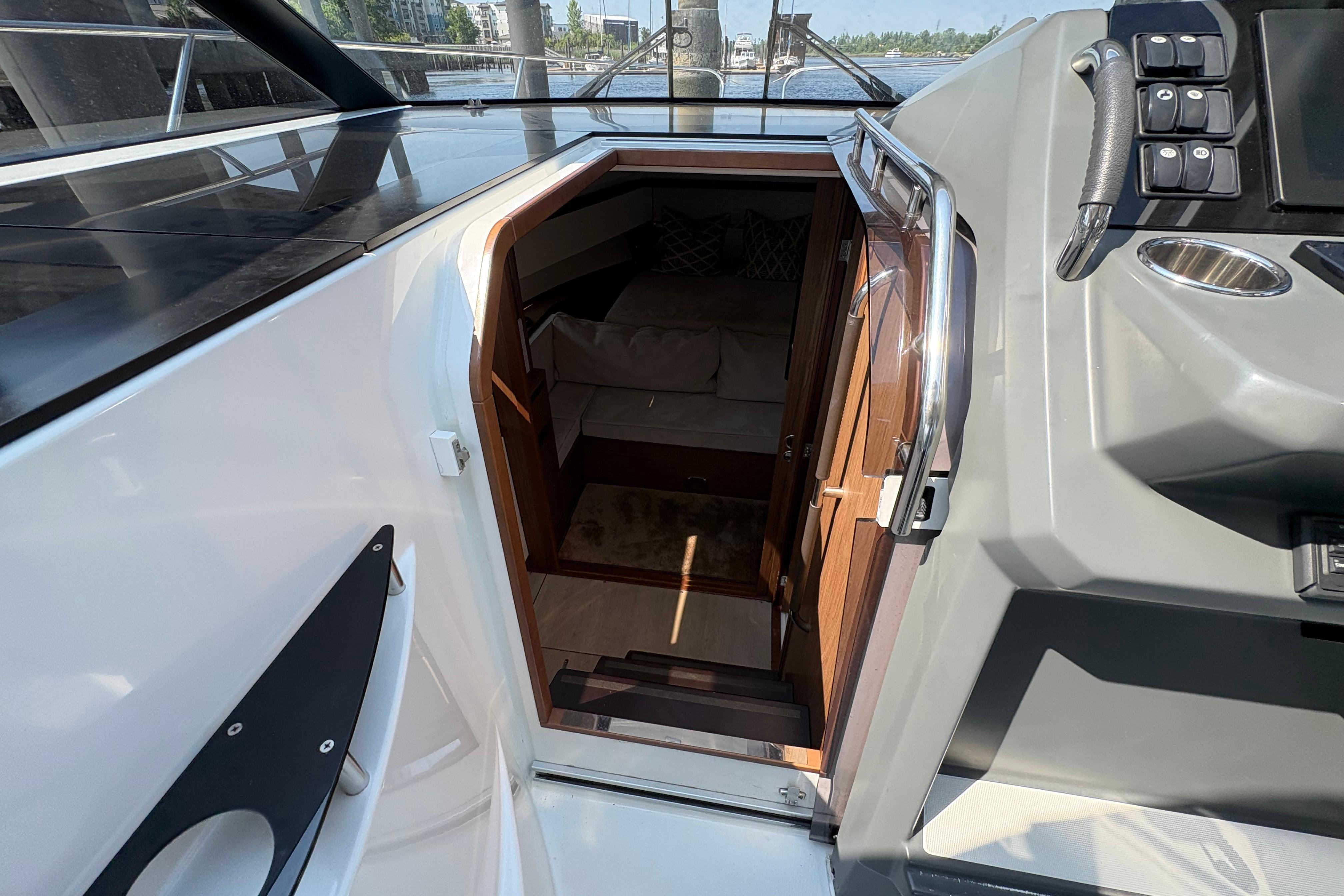 2018 Jeanneau Leader 33 yacht interior entrance with modern cockpit controls.