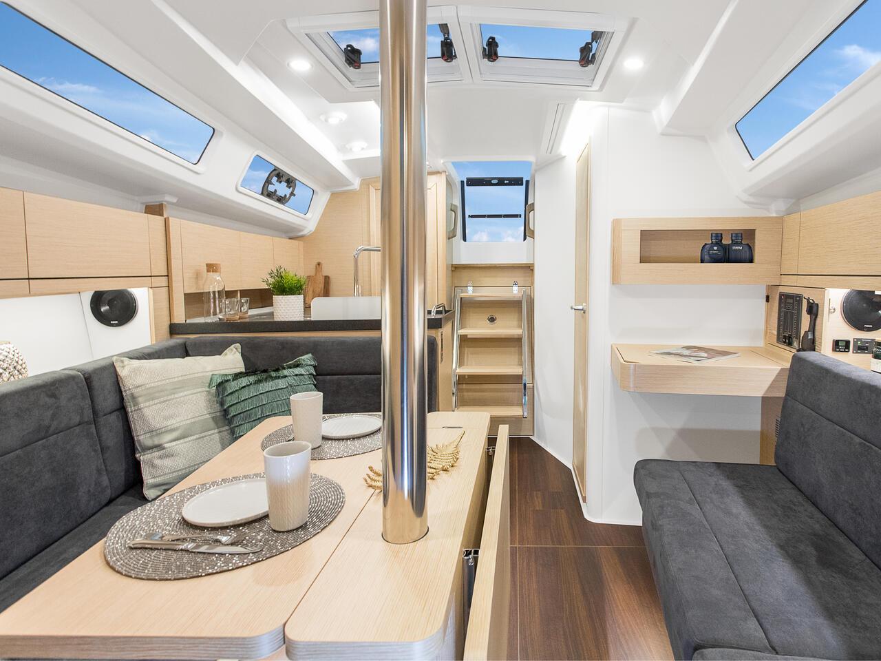 Modern interior of 2024 Hanse 348 sailboat with sleek design and cozy seating.