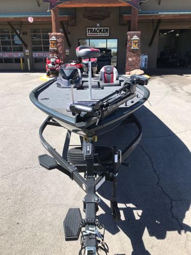 2025 Ranger ALPHA 208 fishing boat on trailer, parked outside a dealership.