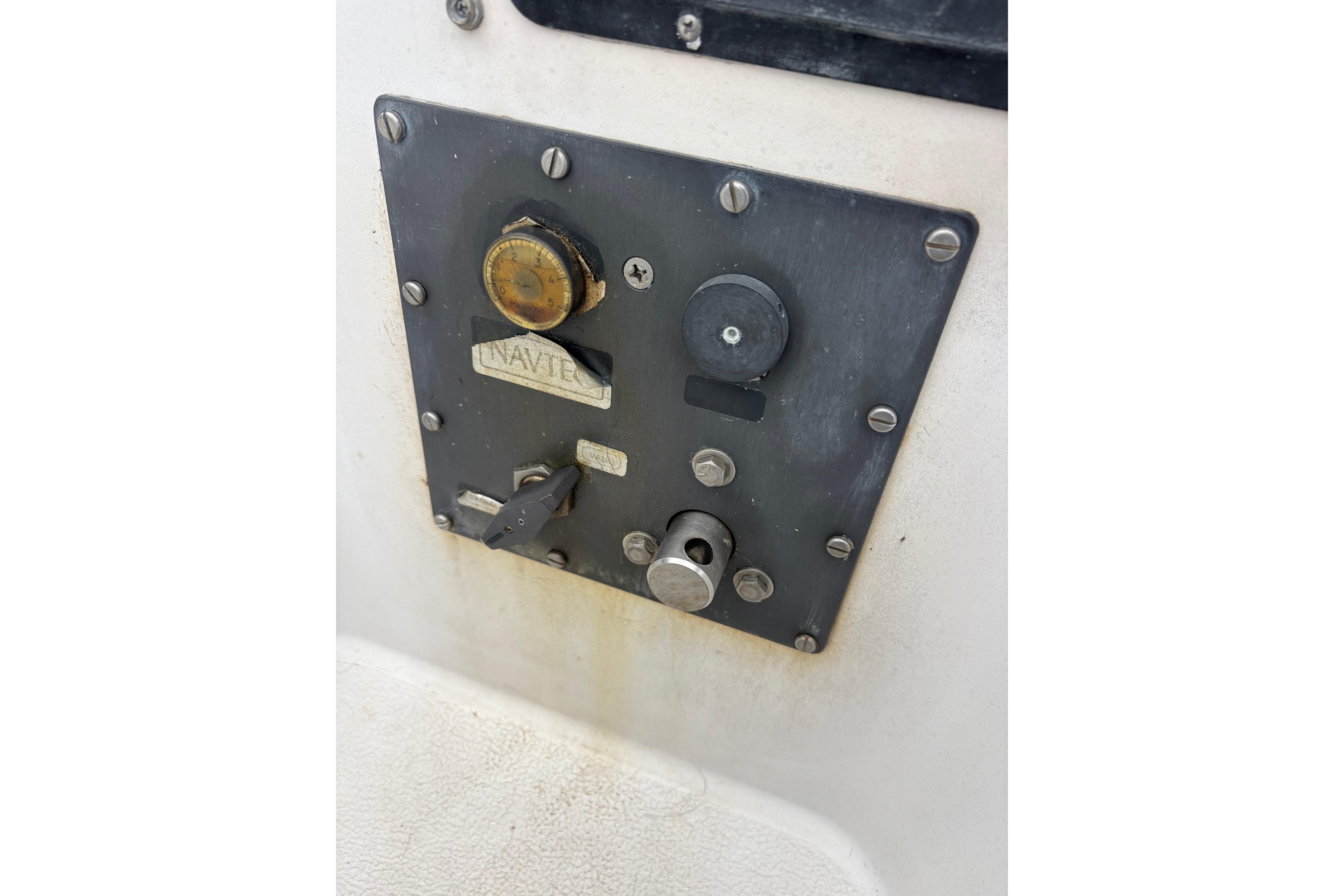 Control panel on 1979 Islander Peterson 40 sailboat, featuring various switches and dials.