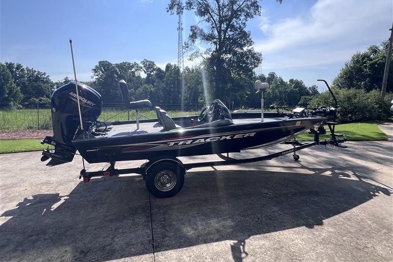 2021 Tracker Pro Team 175 TXW boat on trailer, parked outdoors.