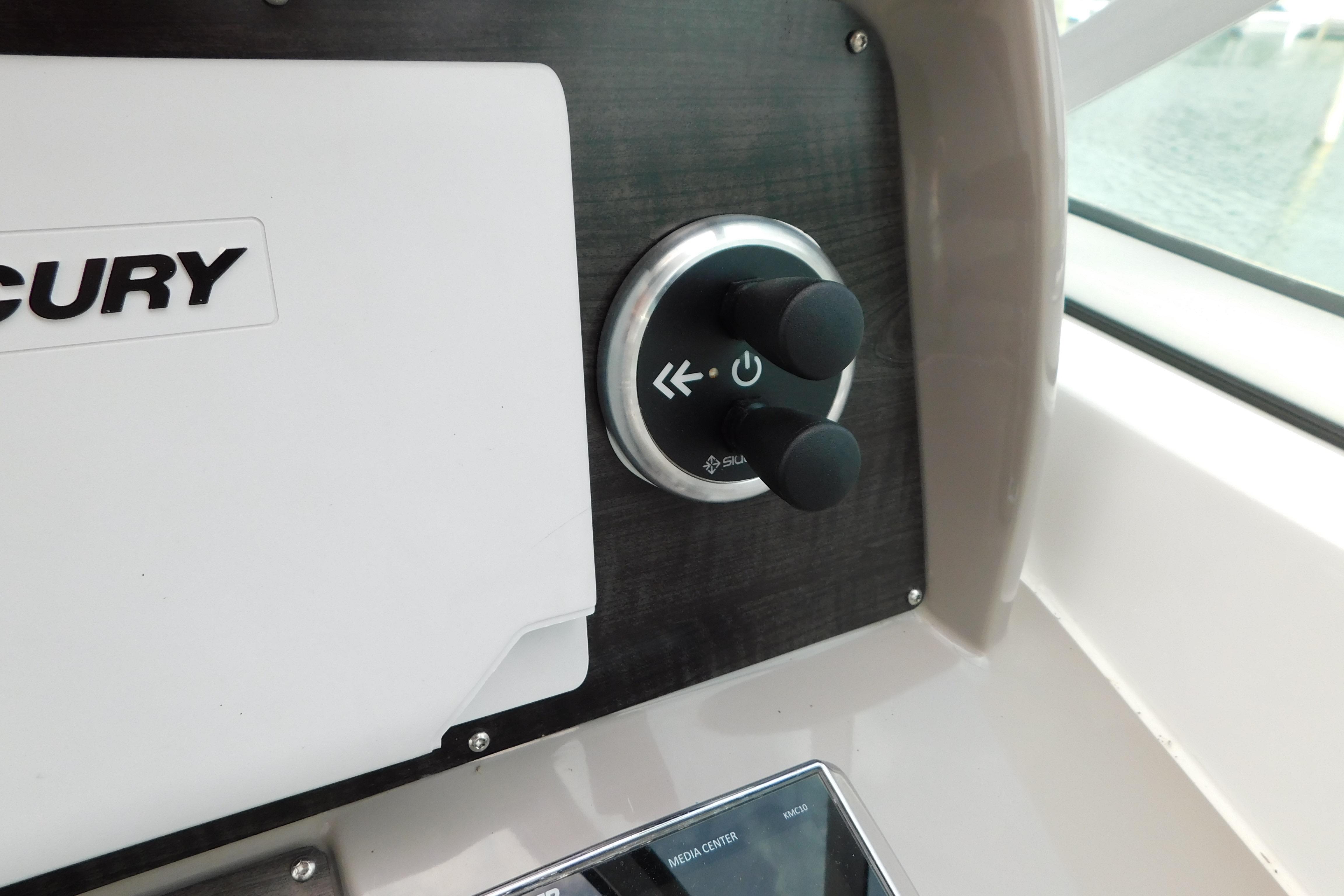Control panel of a 2017 Rinker EX 320 boat with Mercury branding.