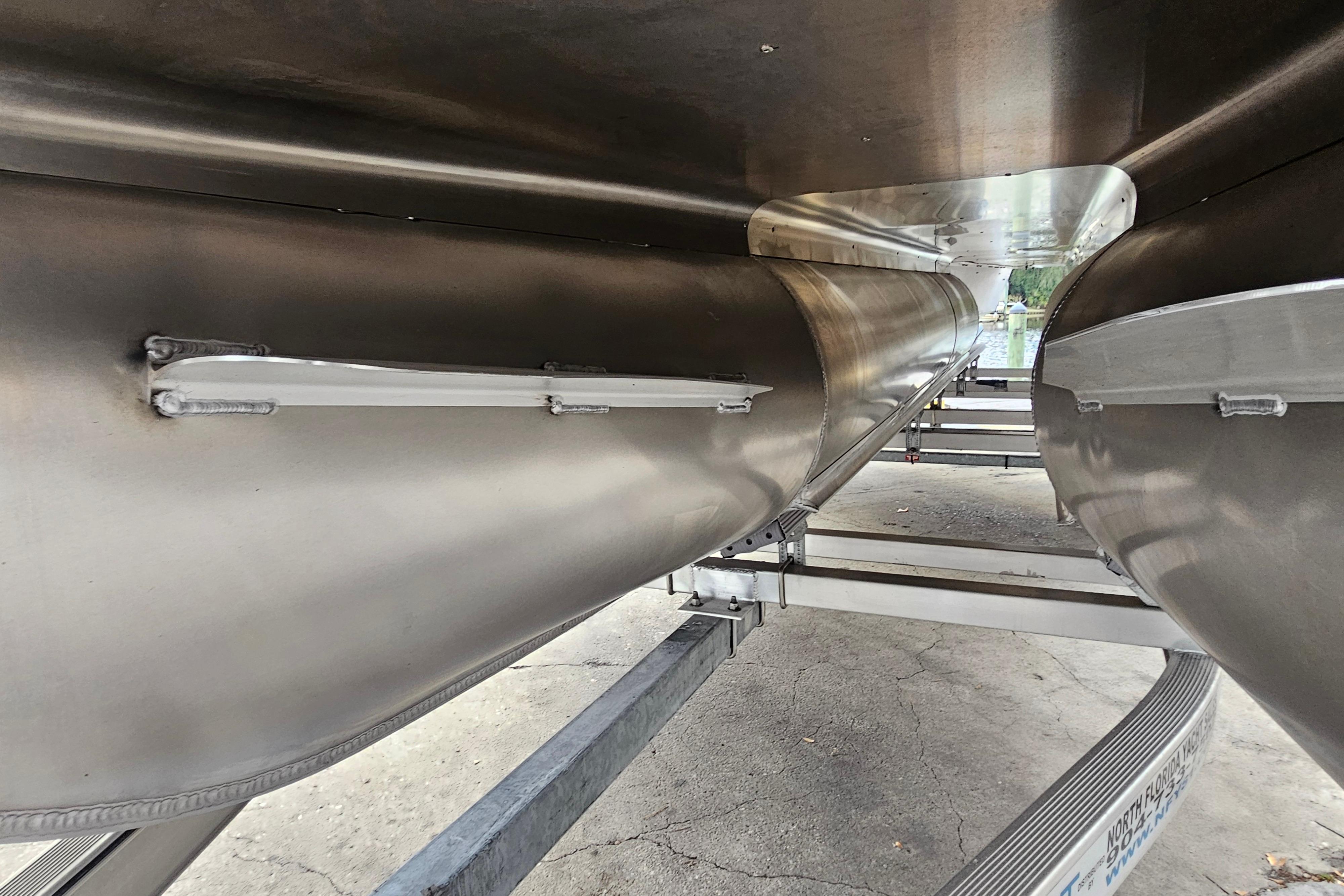 2026 Bentley Pontoons Legacy 243 Cruise undercarriage view, showcasing sleek aluminum pontoons.