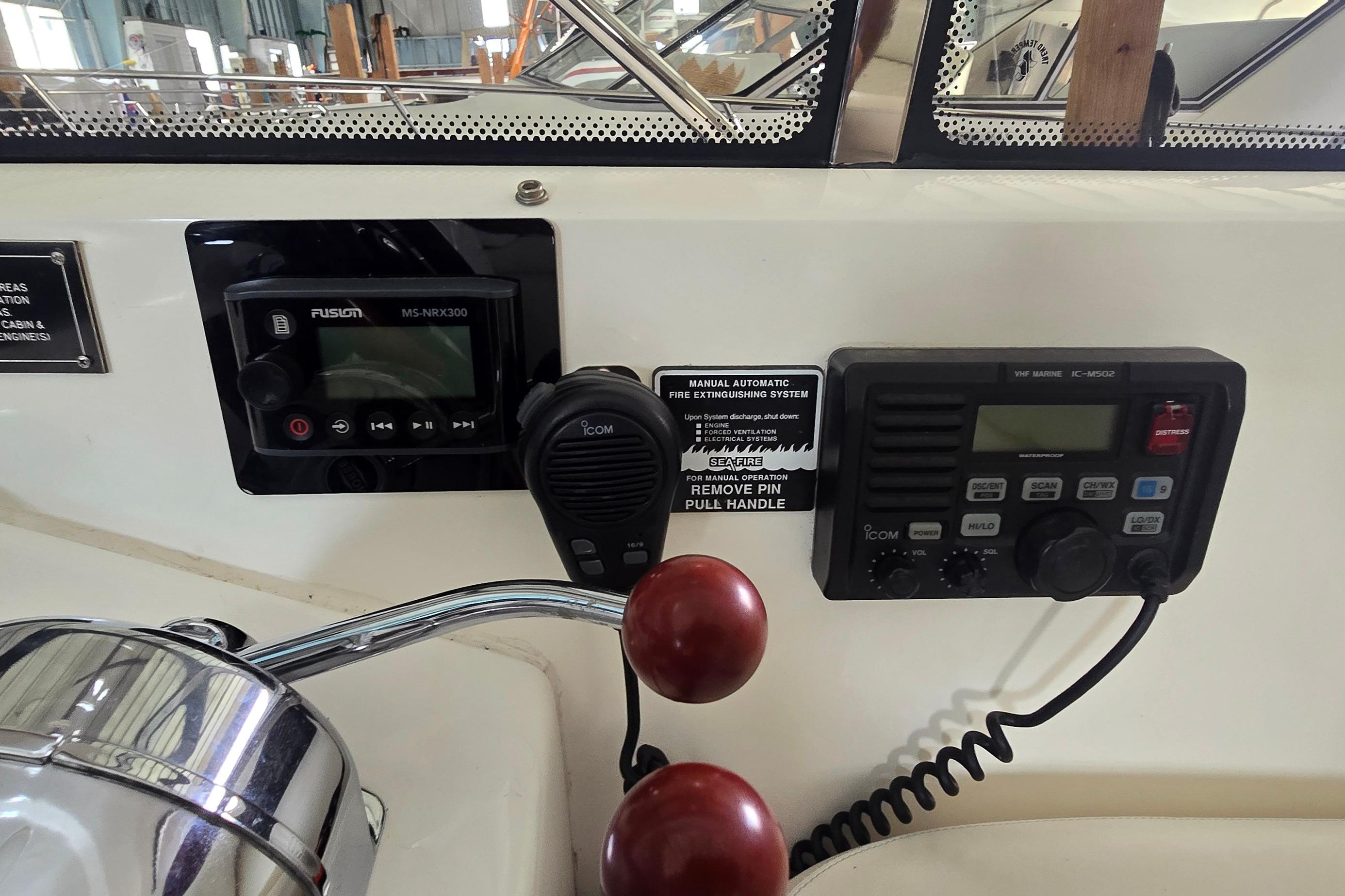 Control panel of a 2004 Sunseeker Camargue 50 yacht with radio and audio systems.