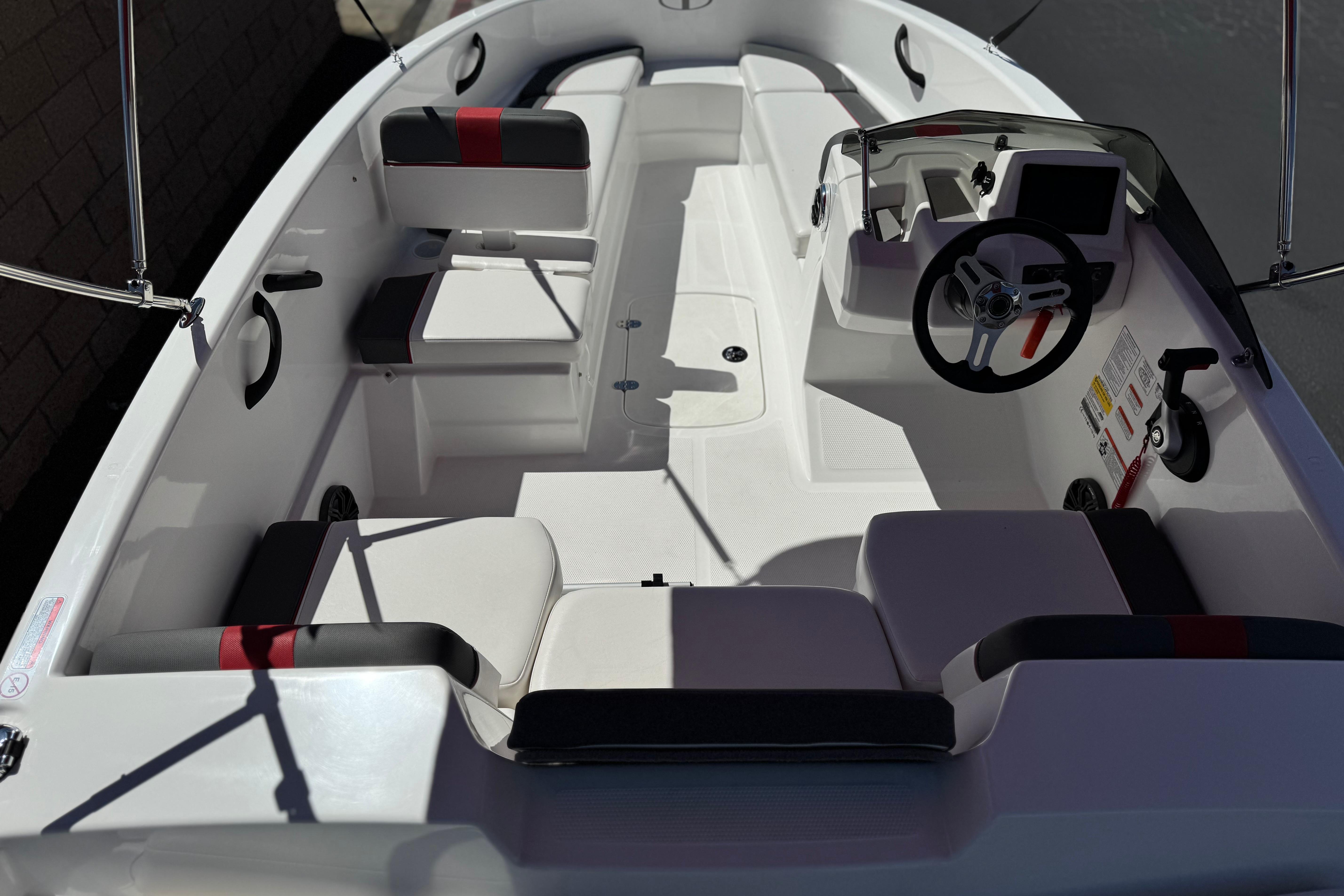 2024 Tahoe T16 boat interior with modern seating and steering console.