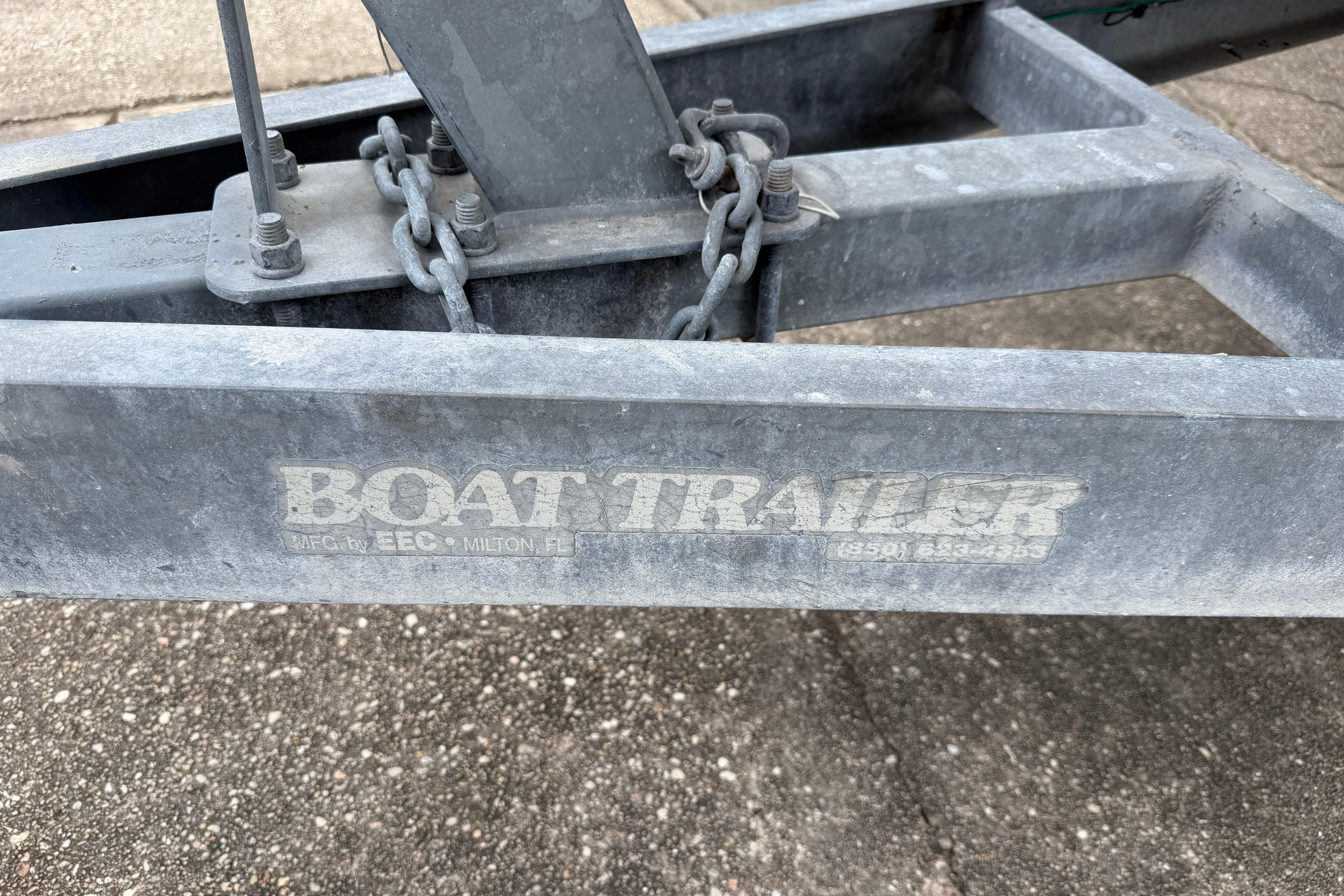 Close-up of a boat trailer hitch with chains, manufactured by EEC in Milton, FL.