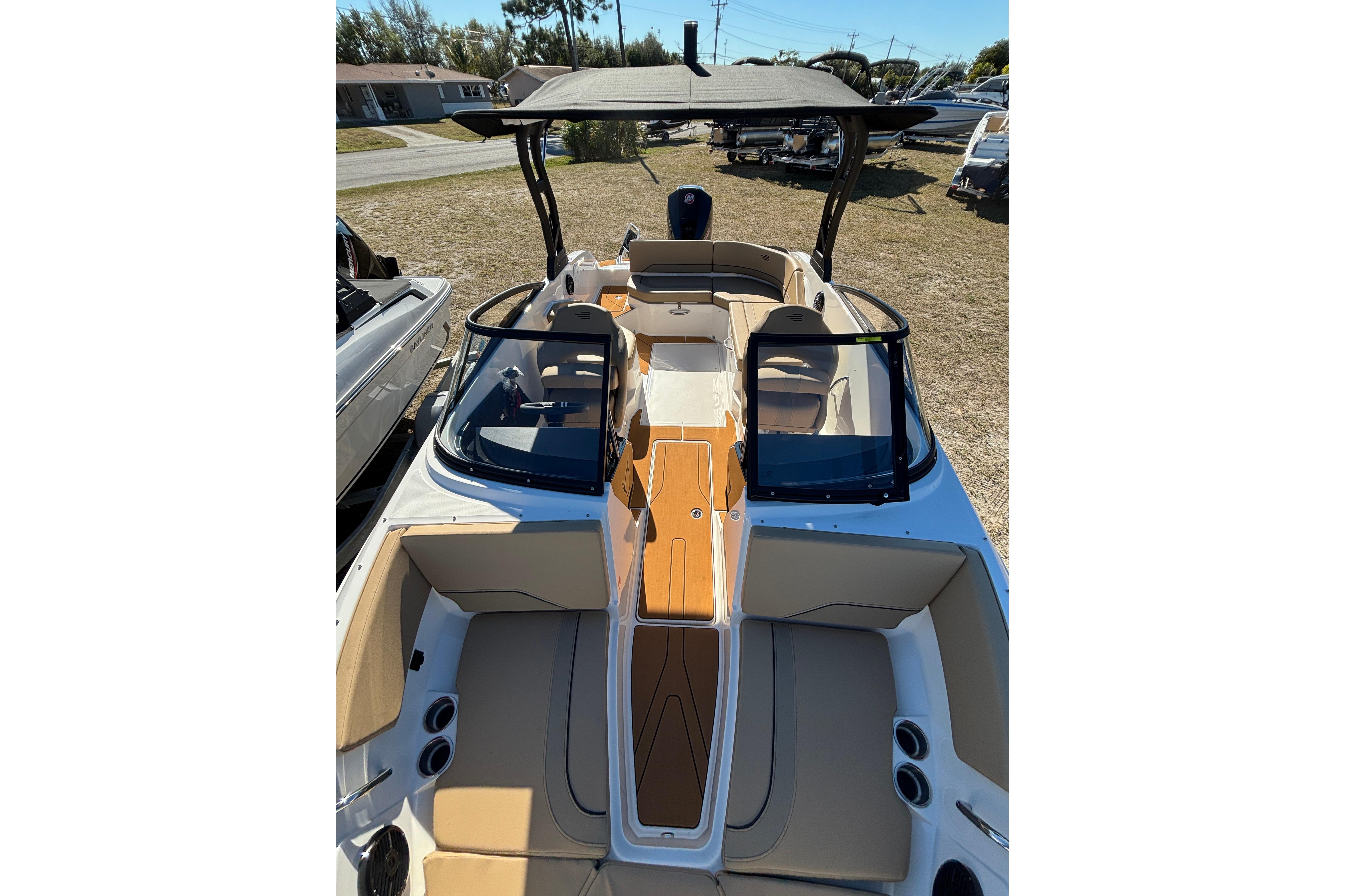 2025 Bayliner V20 boat interior with tan seating and sleek design.