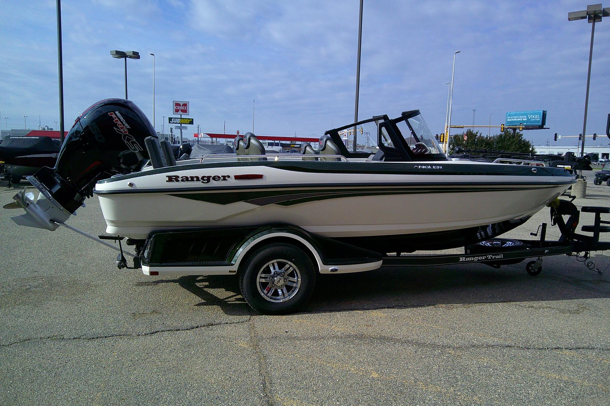 2026 Ranger 1880MS boat on trailer in parking lot, featuring sleek design and powerful engine.