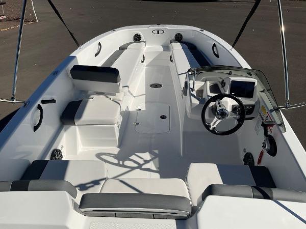 2025 Tahoe T18 boat interior with seating and steering wheel.