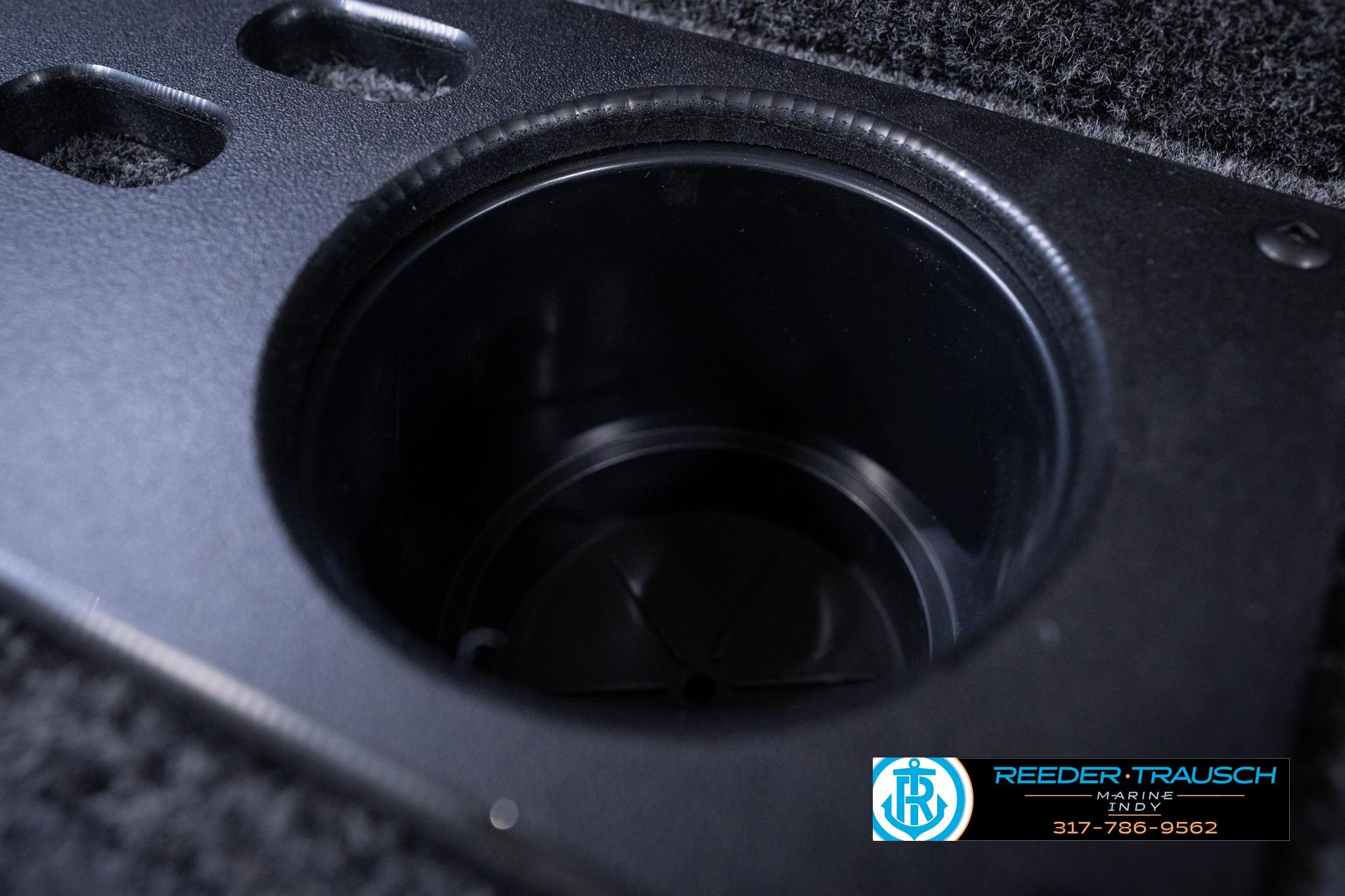 Cup holder detail in 2026 Lund 1775 Impact XS SS boat interior.