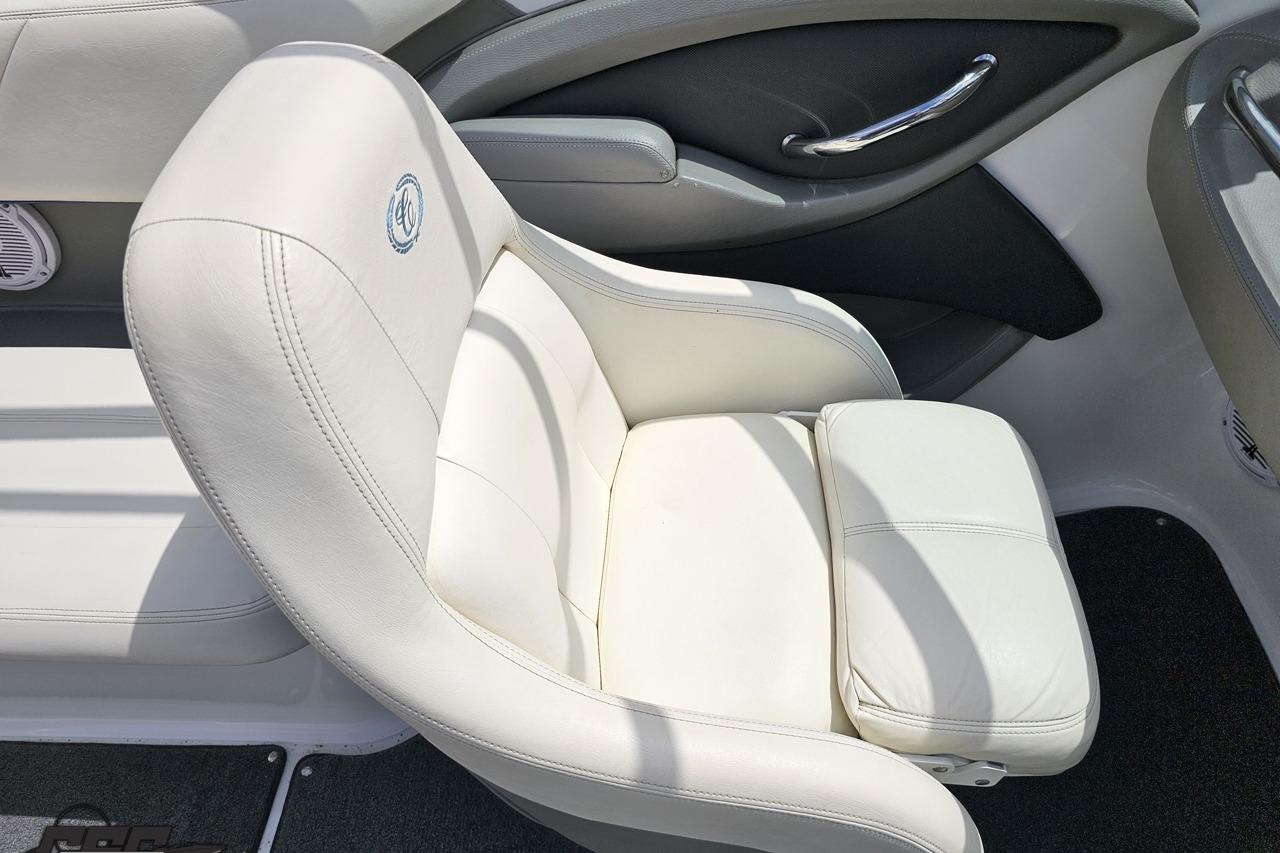 White leather seat in a 2010 Cobalt 232 WSS boat, featuring sleek design and comfort.