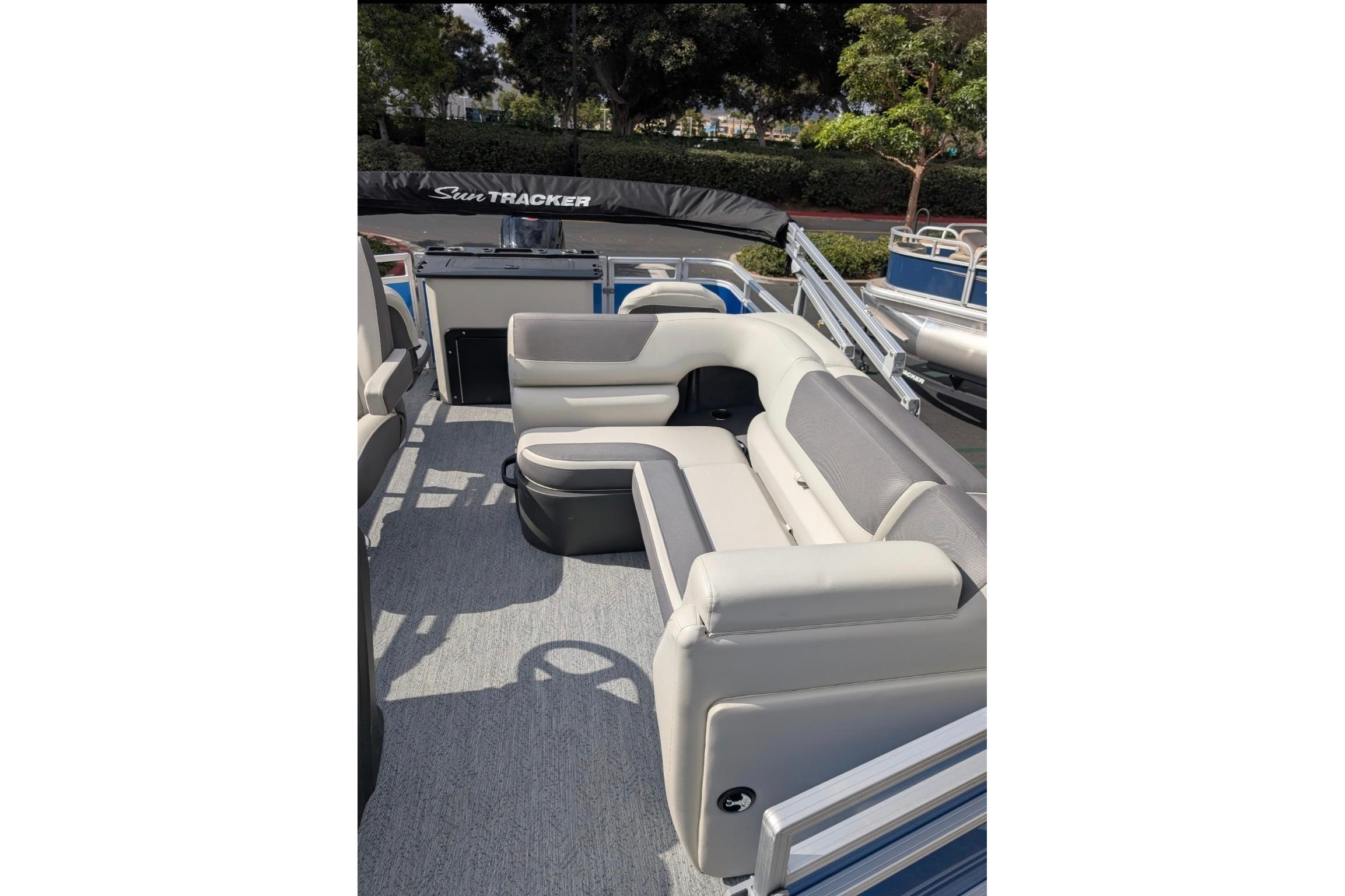 2026 Sun Tracker Fishin' Barge 20 DLX interior with comfortable seating and modern design.