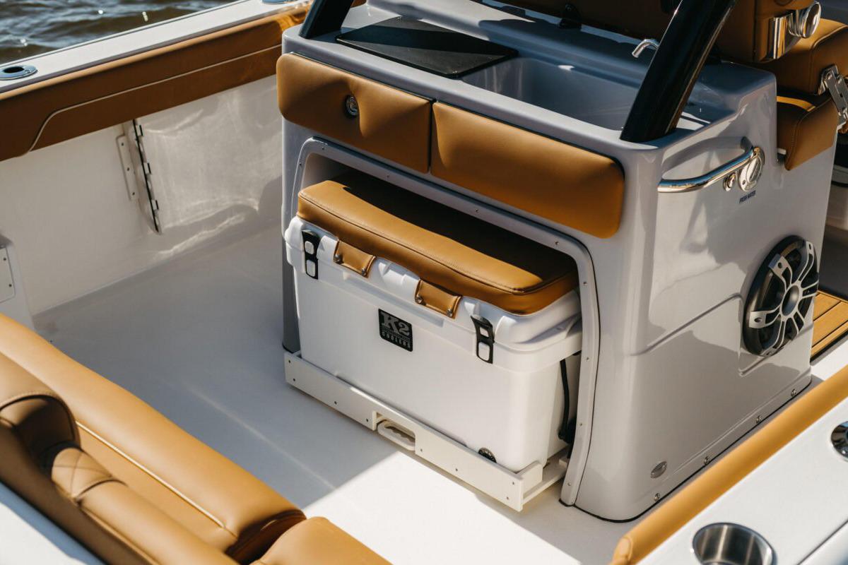 Manufacturer Provided Image: 2025 Key West 239 FSR boat interior with tan seating and built-in cooler.