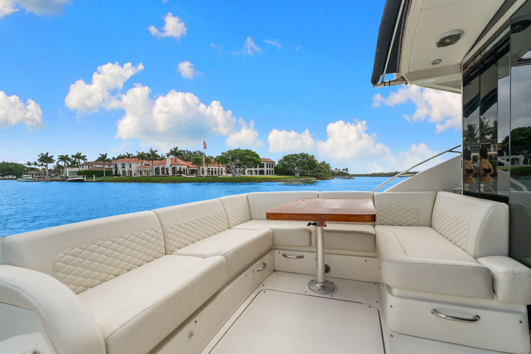 The image shows the stern of a 2017 Sea Ray Sundancer 510 with a luxurious seating area.