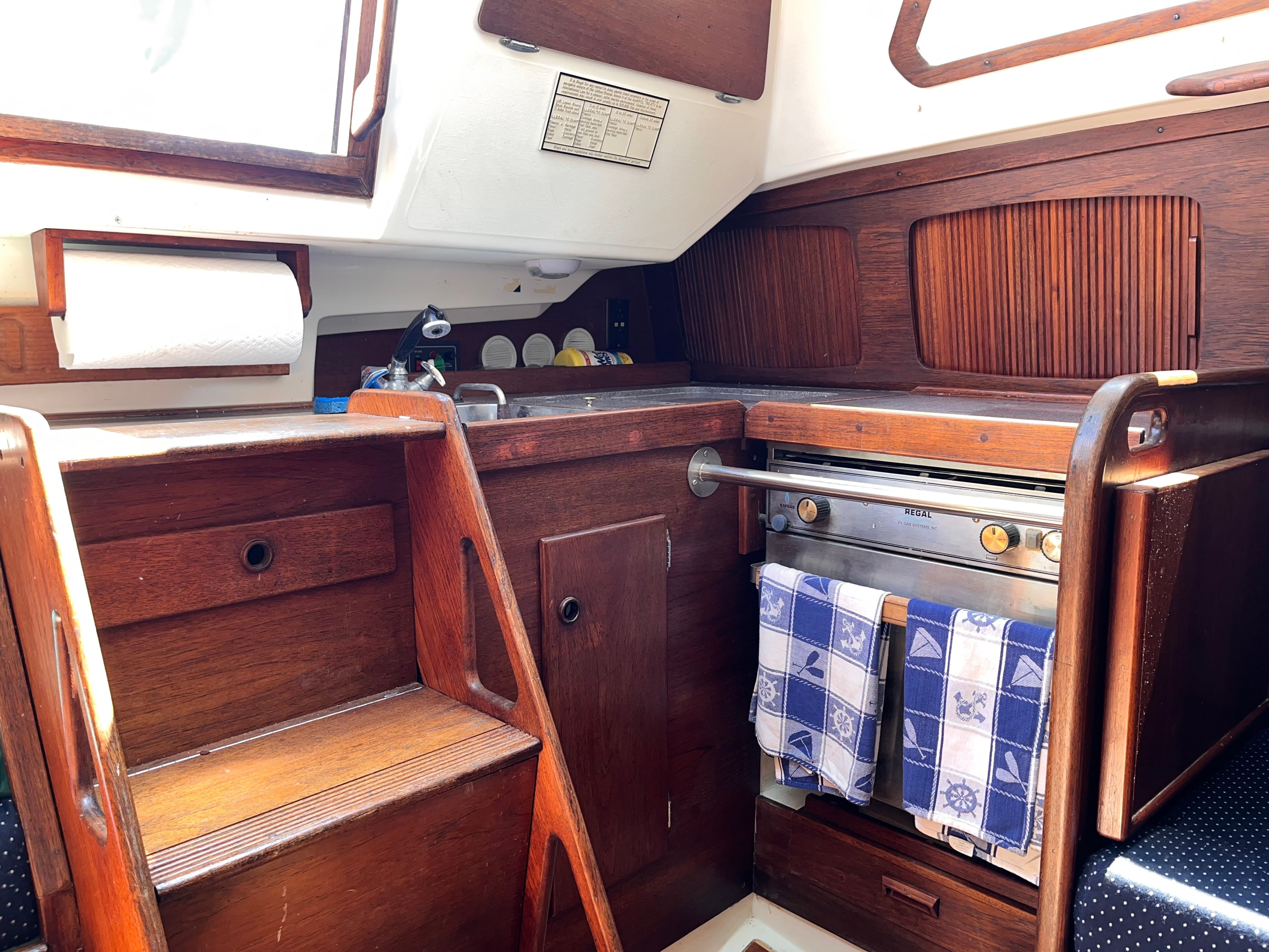 Interior of a 1989 Sabre 30 III yacht with wooden cabinetry.