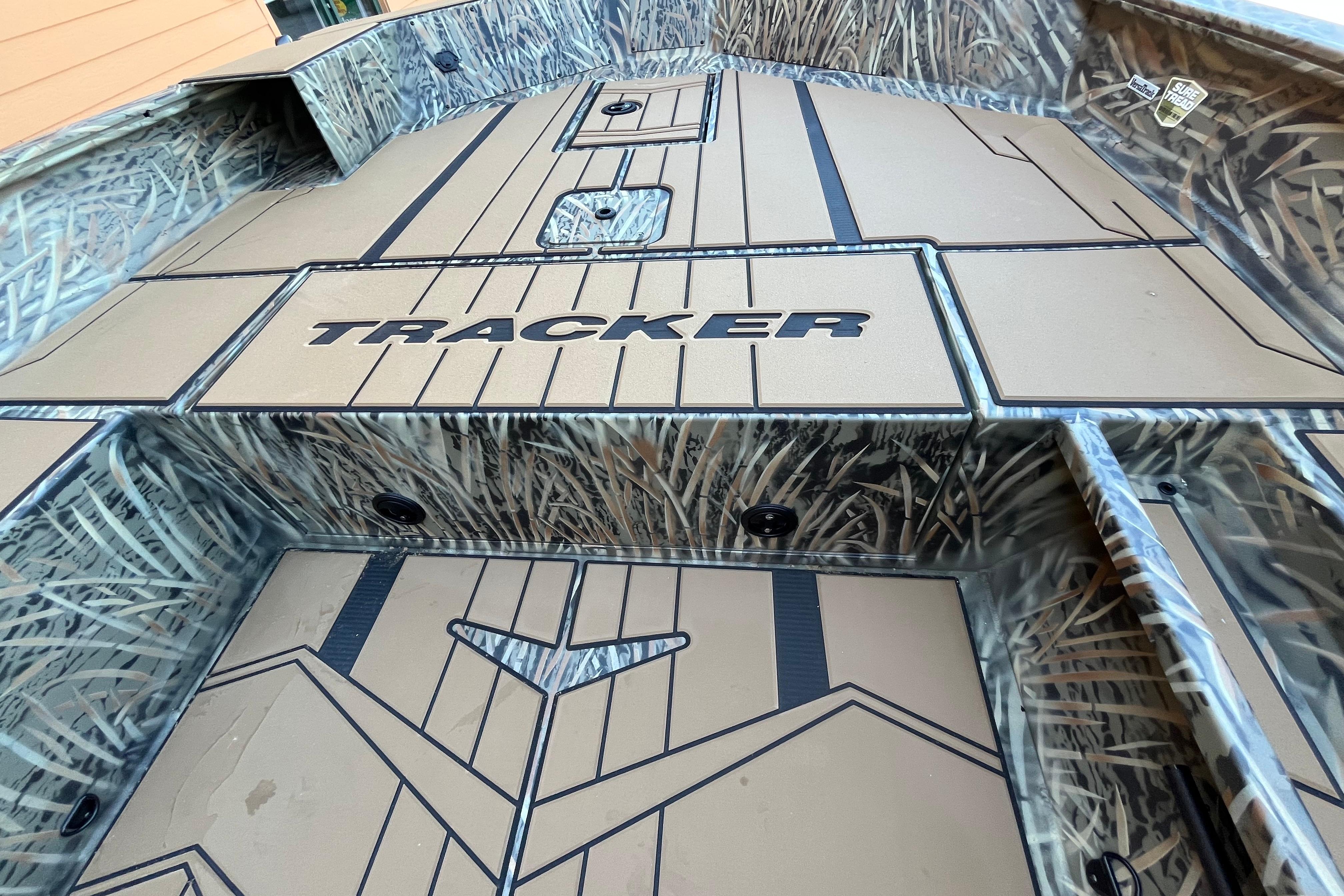 2026 Tracker Grizzly 1756 T Marsh boat interior with camo design and logo.