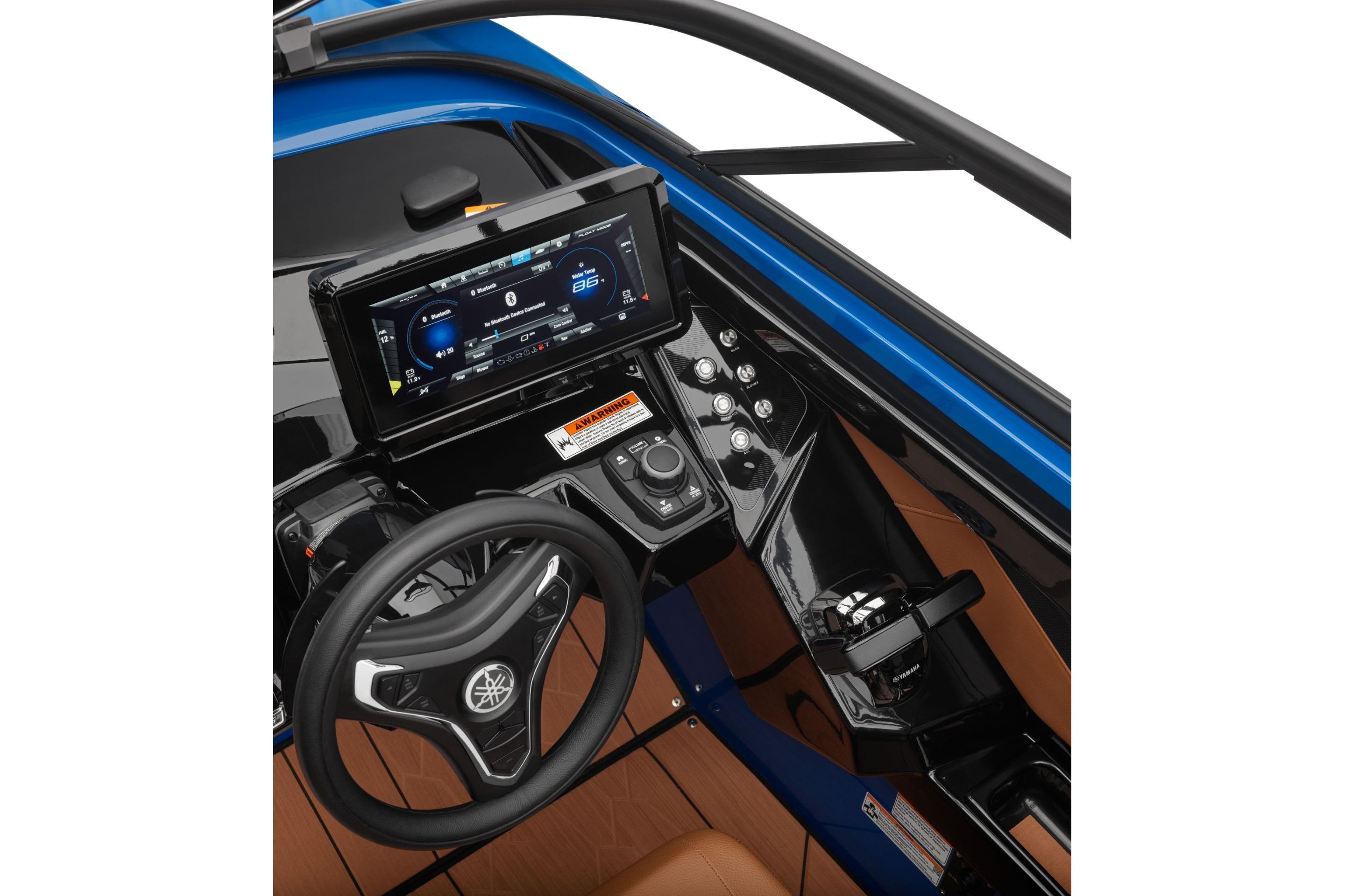 2026 Yamaha Boats 255XD dashboard with steering wheel and digital display.