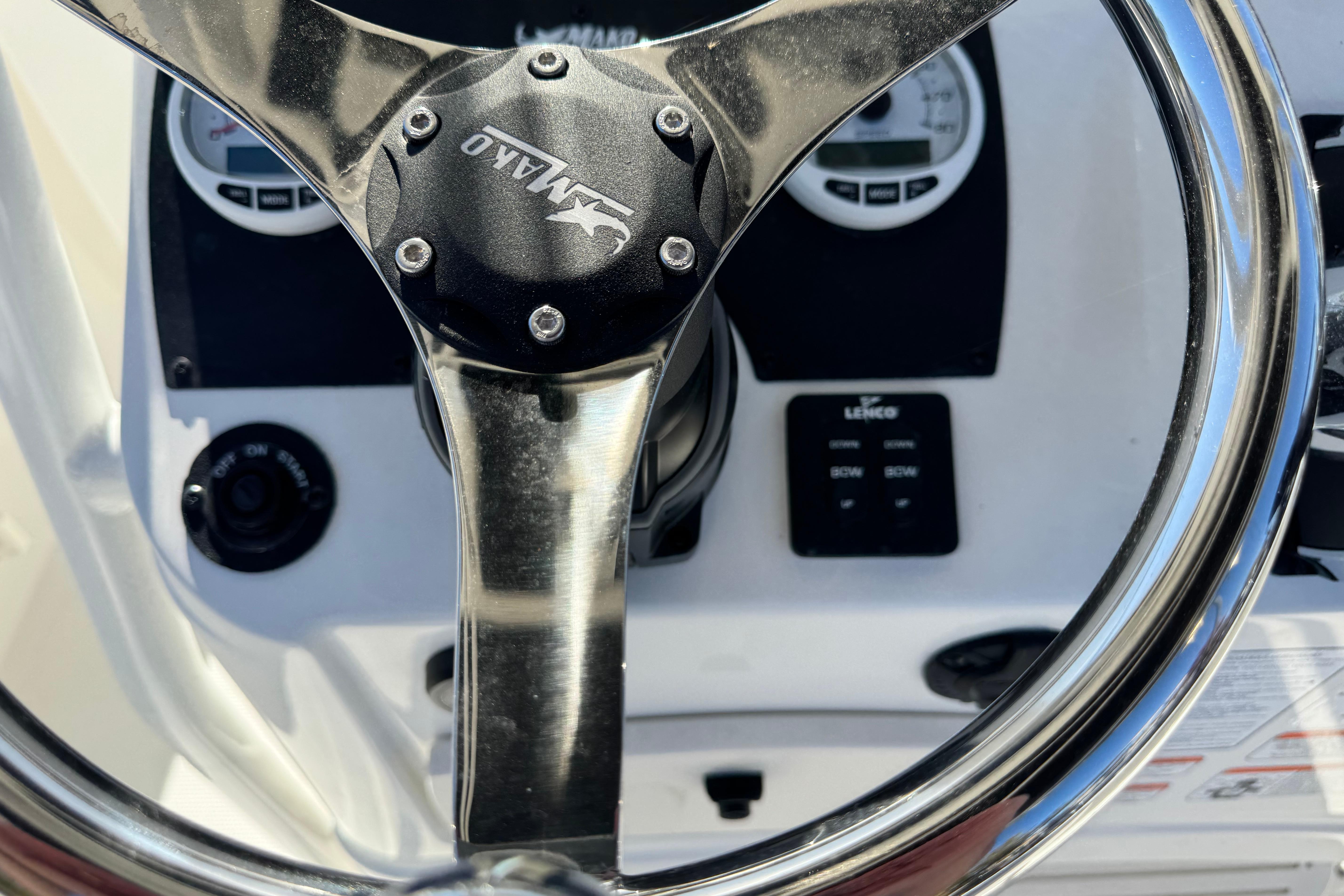 Steering wheel of 2026 Mako 214 Center Console boat with control panel.