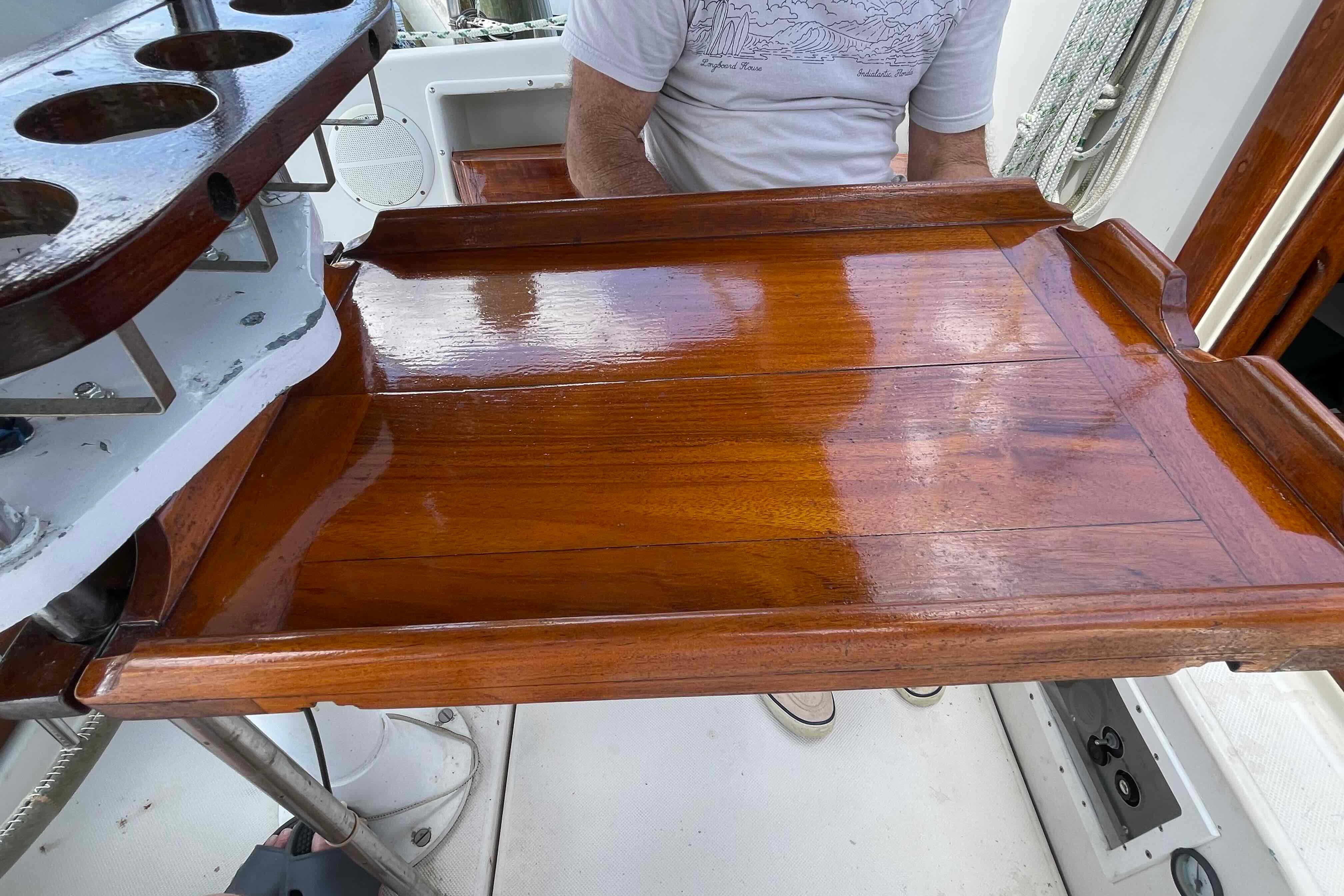 Polished wooden tray on 1987 Pacific Seacraft 34 sailboat, showcasing craftsmanship and design.