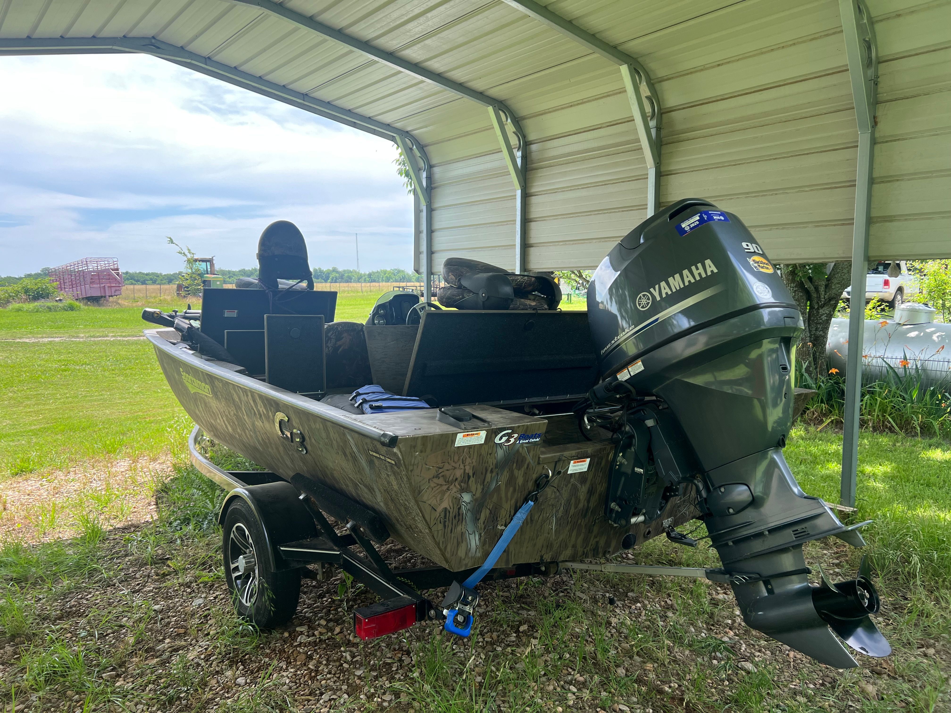 2017 G3 Sportsman 17 Camo with Yamaha motor under a carport.