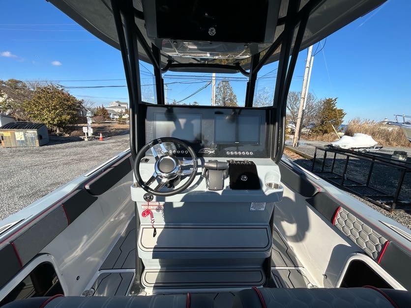 2024 Glasstream 32 GSX boat cockpit with modern steering and controls.