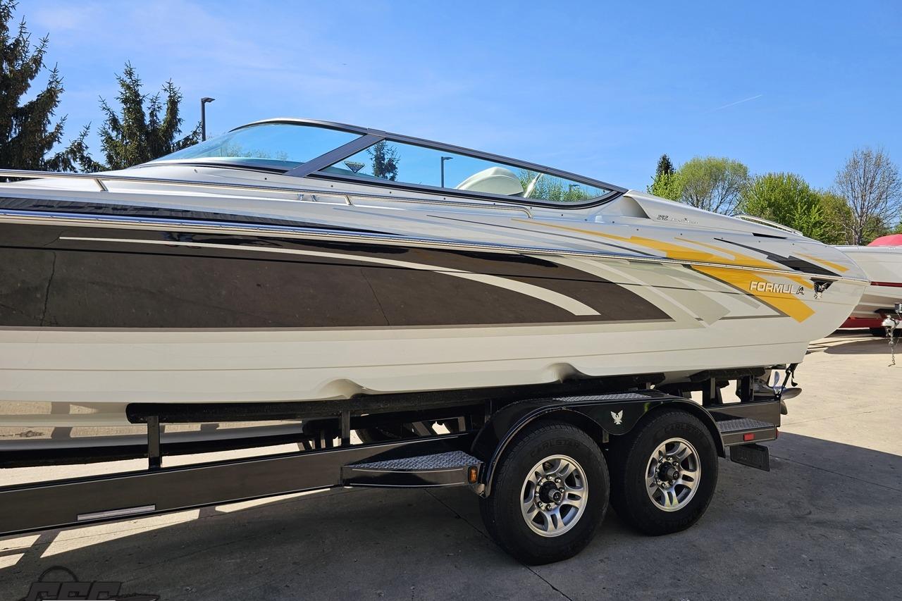 2014 Formula 292 FASTech boat on trailer, sleek design with vibrant graphics.