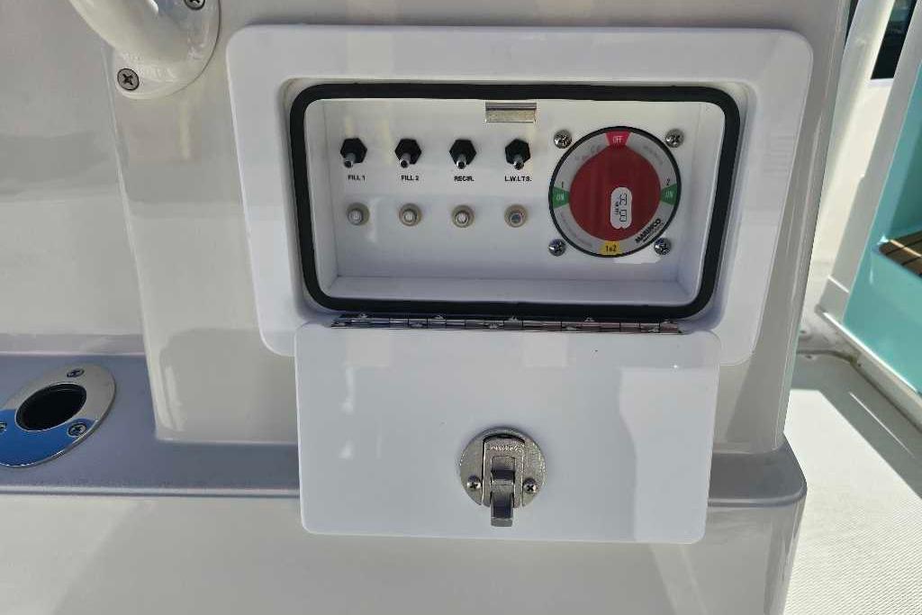 Control panel on a 2025 Ranger 2510 Bay boat with switches and gauge.