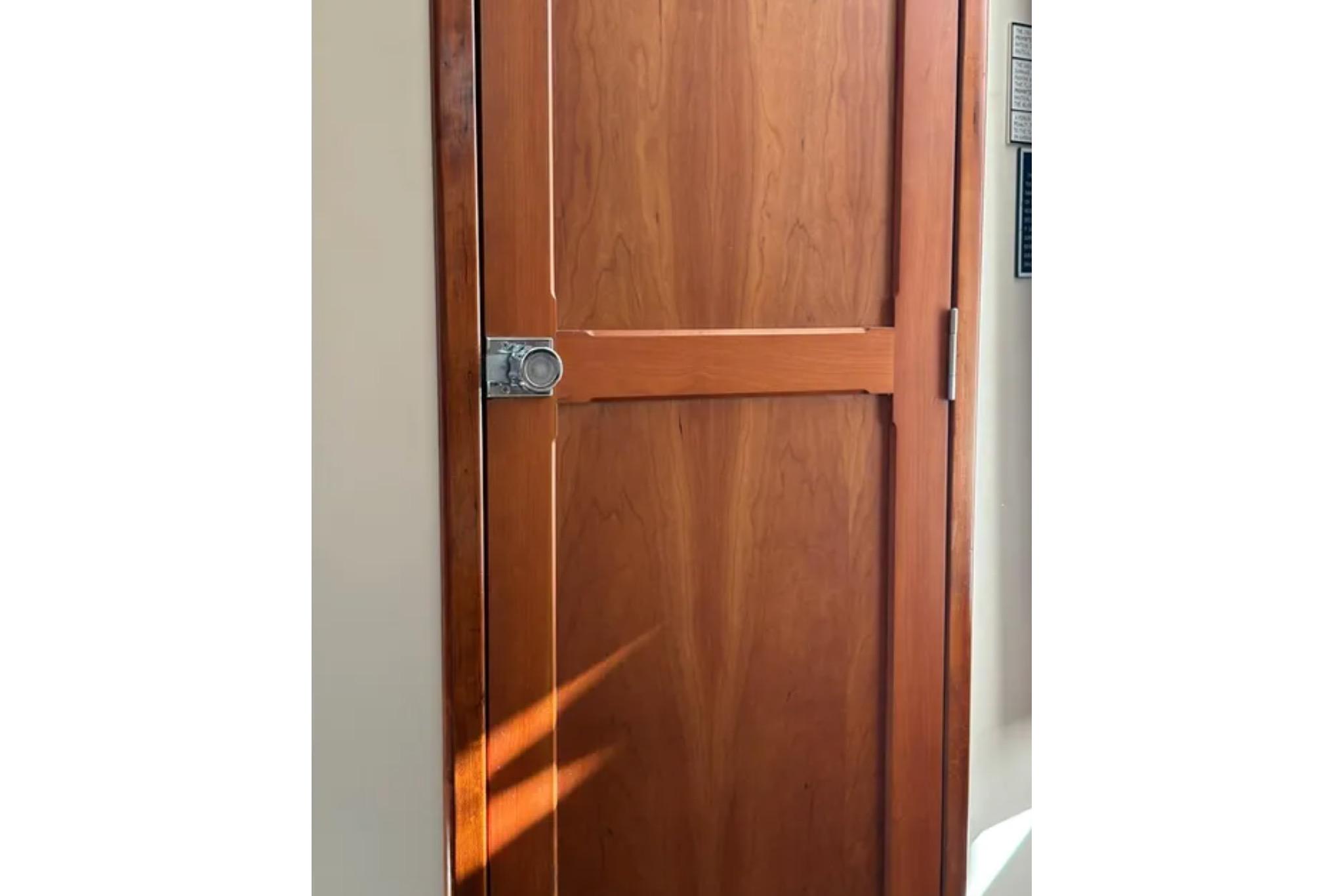 Wooden cabin door on a 2005 Albin 28 Tournament Express boat.