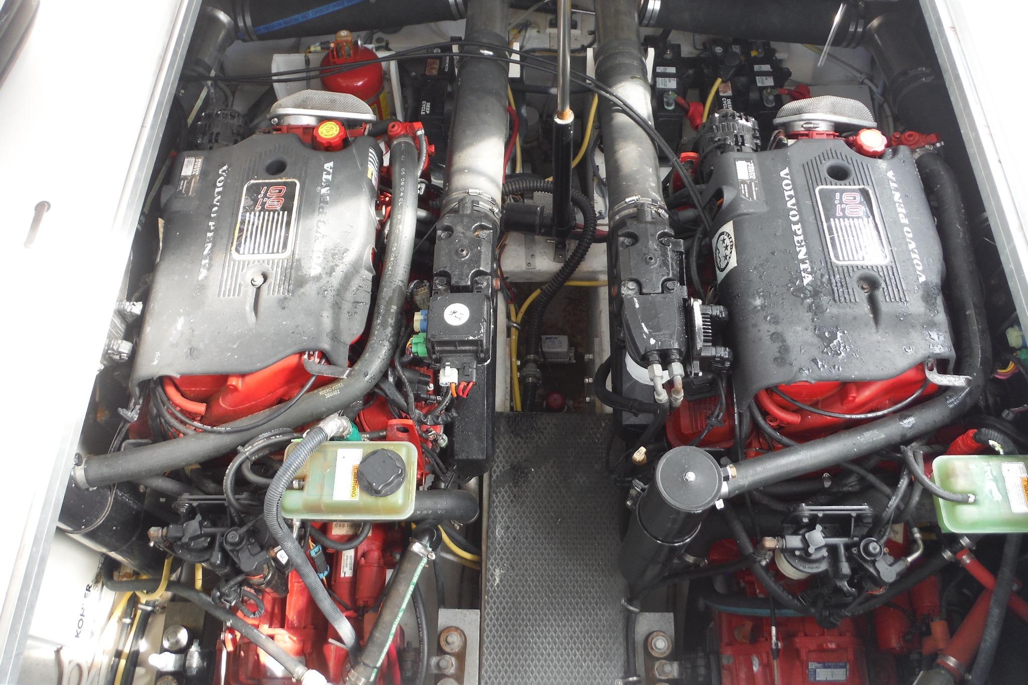 Engine compartment of a 2005 Chaparral Signature 350 boat with dual Volvo Penta engines.