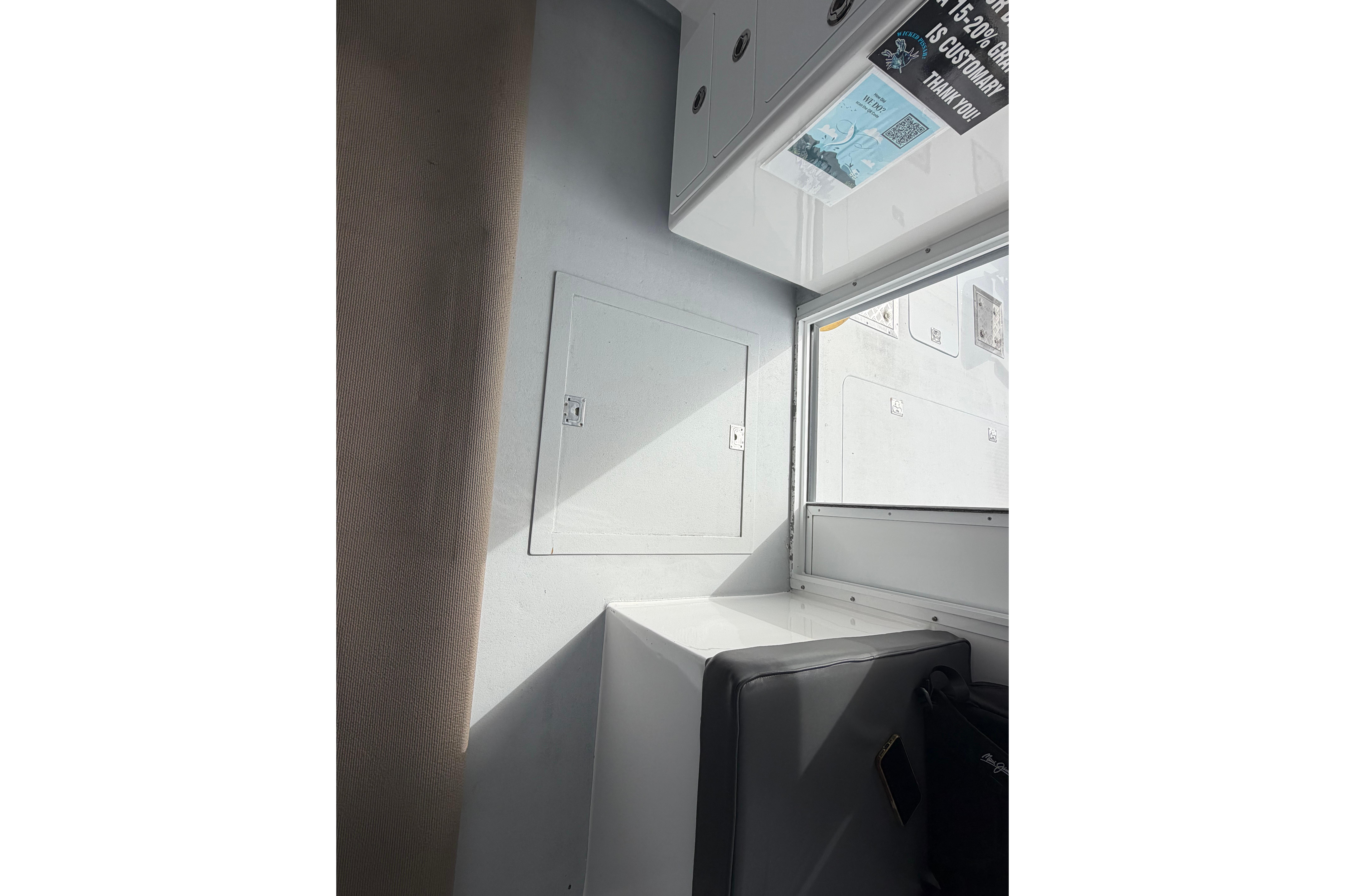 Interior of 2018 H&H Marine Osmond Beal boat, featuring seating and storage compartments.