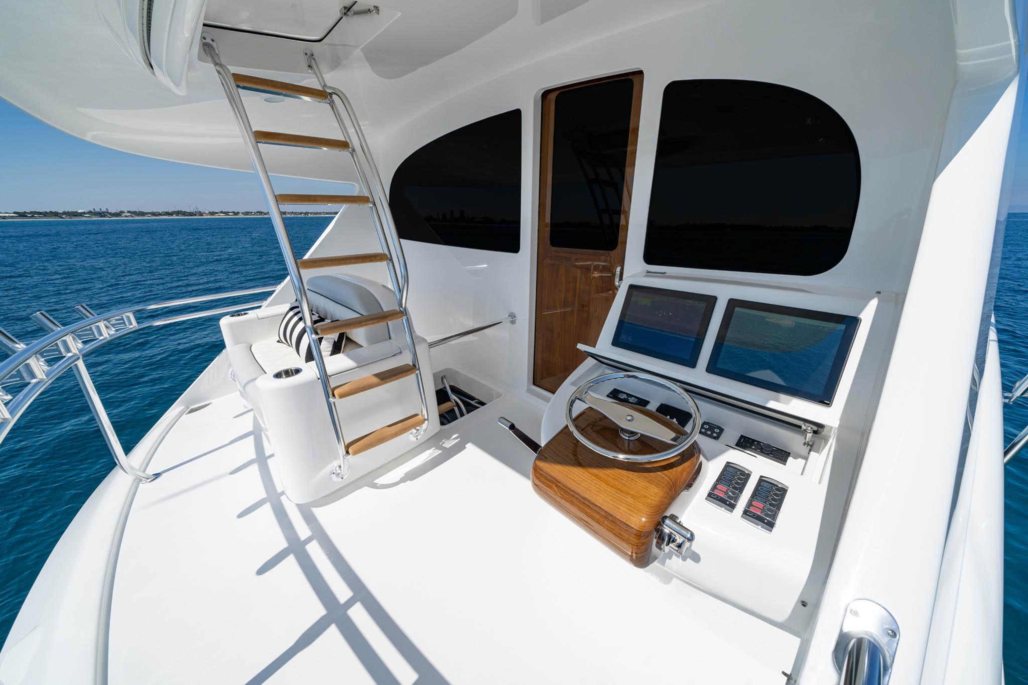Luxury Viking 90 Sky Bridge yacht helm with modern controls, ocean view, 2026 model.