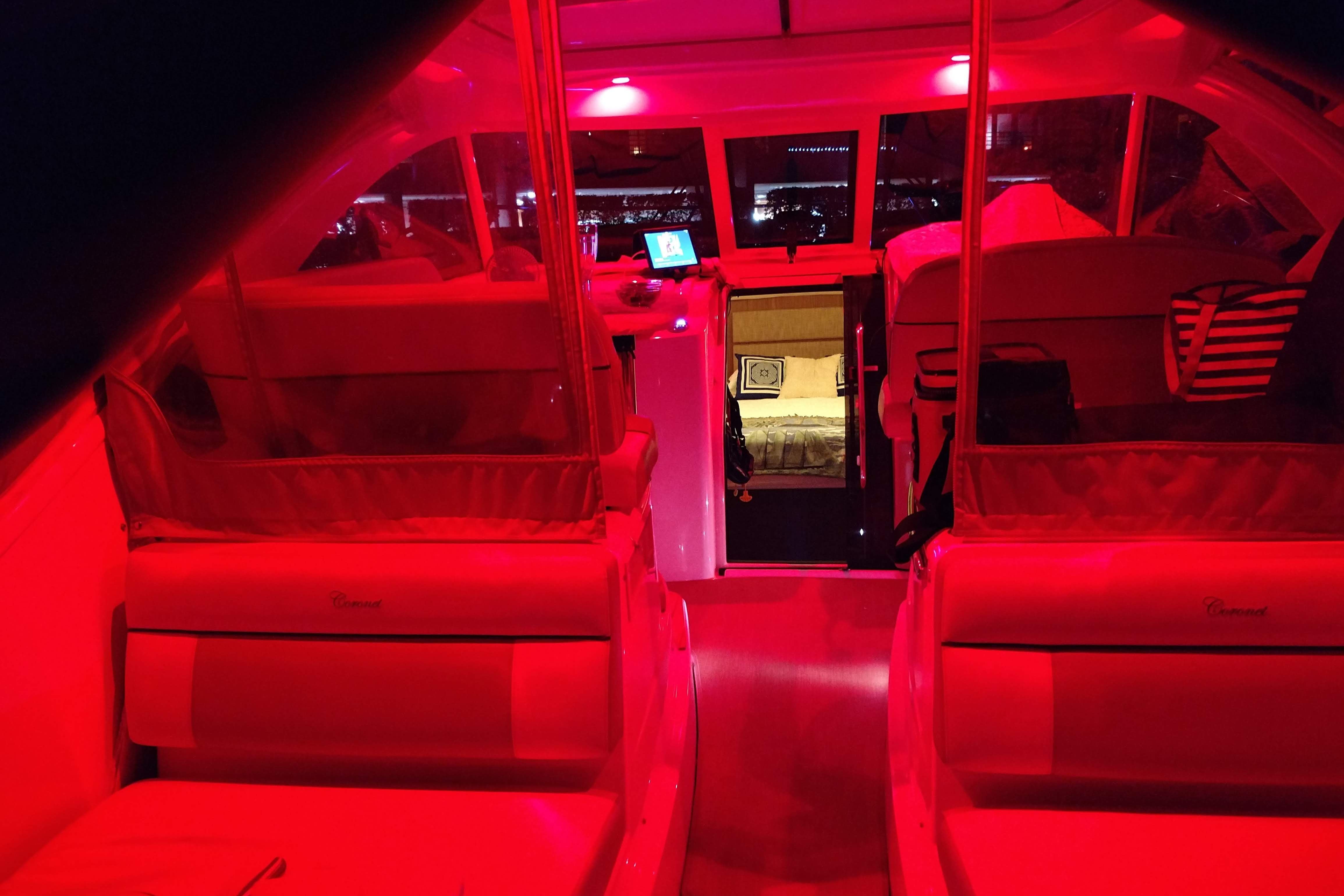 Interior of a Tiara Yachts 3100 Coronet with red lighting.