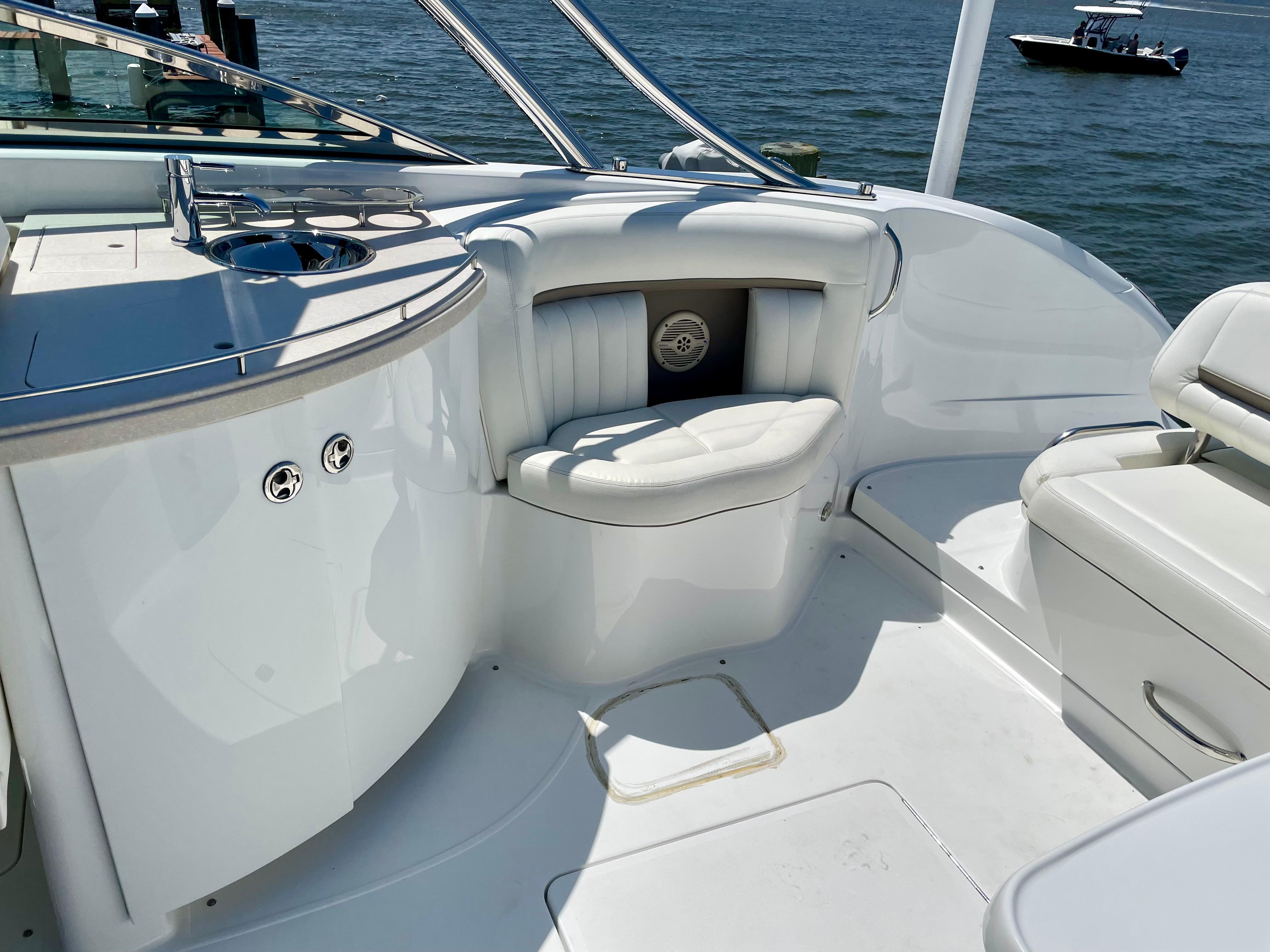 2006 Cobalt 323 boat interior with white seating and sleek design on the water.