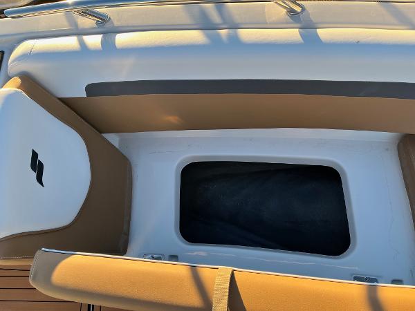 2024 Starcraft SVX 191 boat interior storage compartment with cushioned seating.